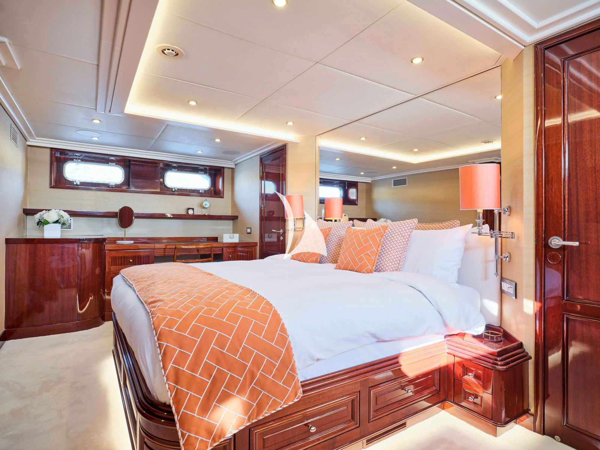 a bedroom with a bed and a desk aboard MIA ZOI Yacht for Charter