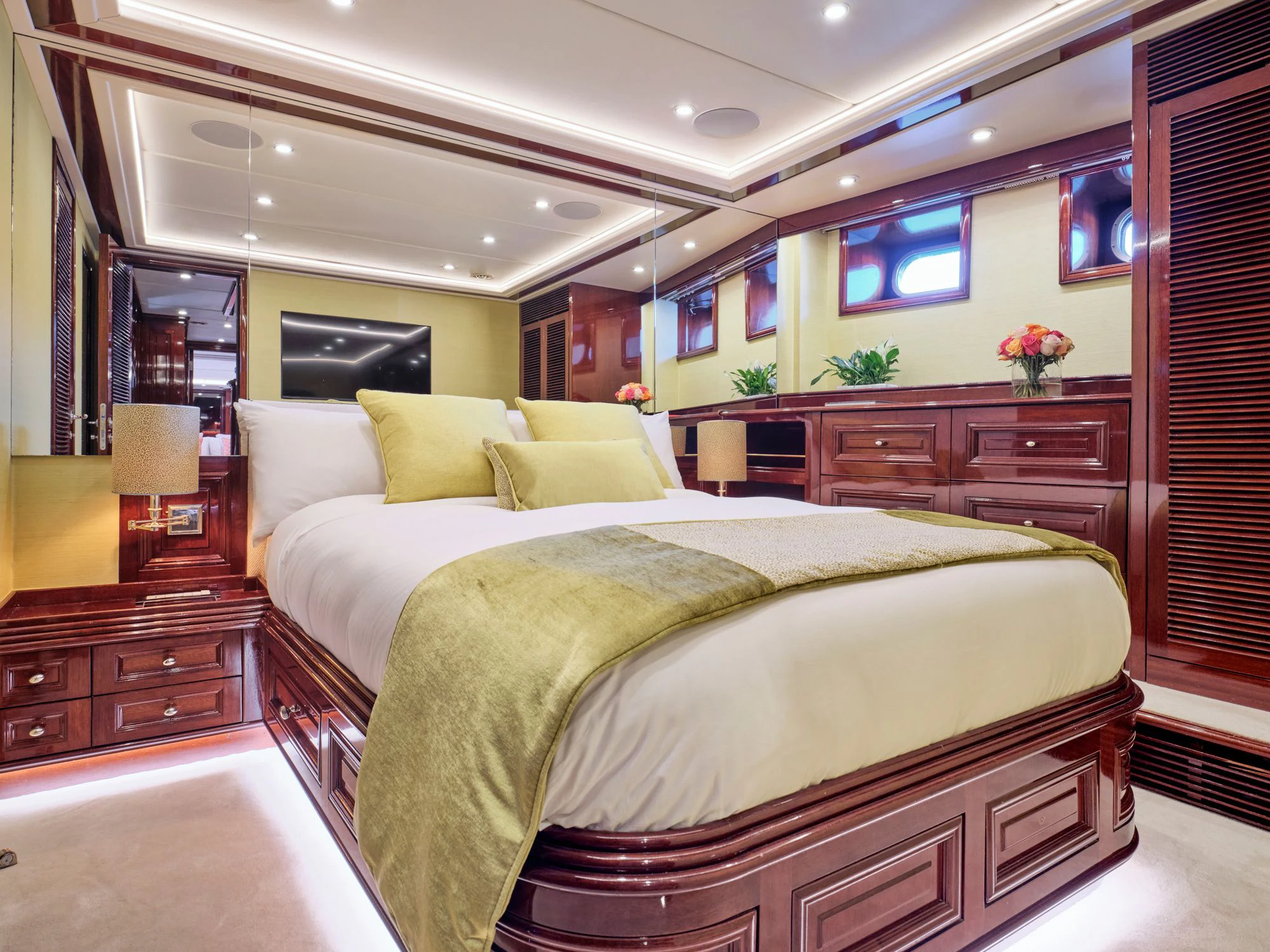 a bedroom with a bed and a desk aboard MIA ZOI Yacht for Charter