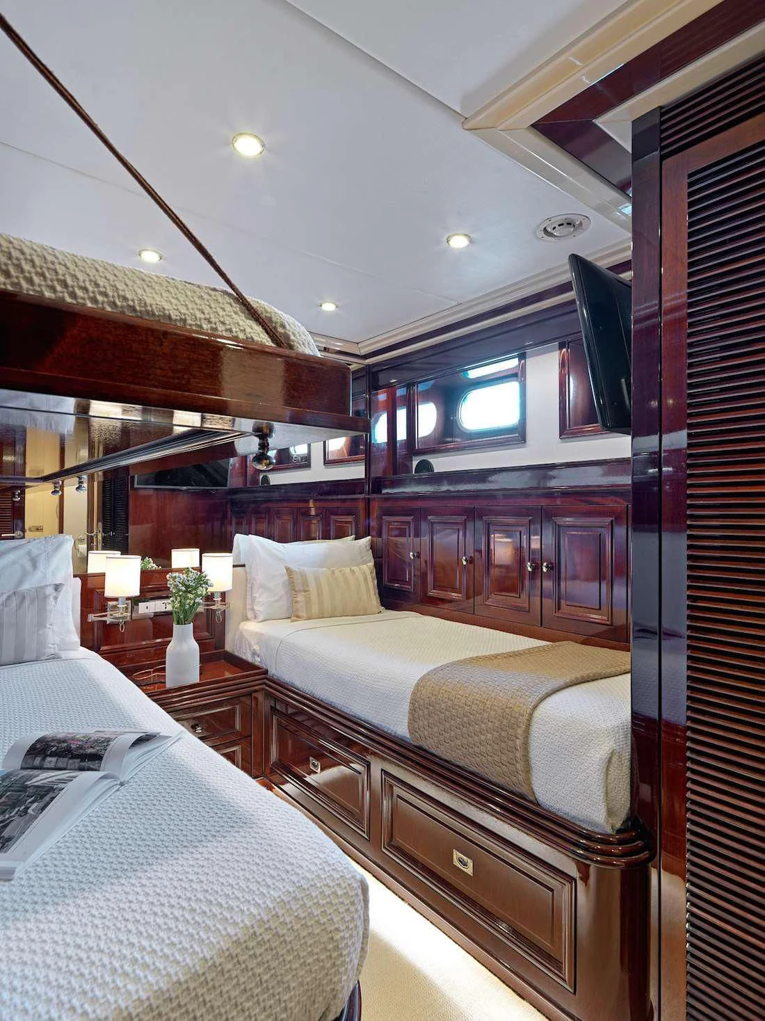 a room with a bed and a desk aboard MIA ZOI Yacht for Charter