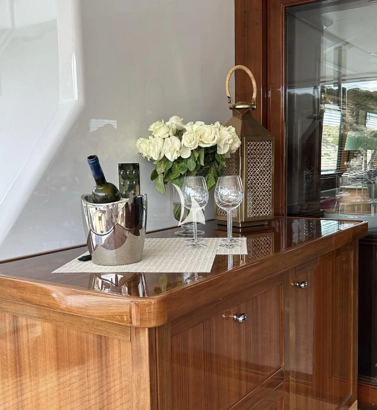 a vase of flowers on a counter aboard MIA ZOI Yacht for Charter