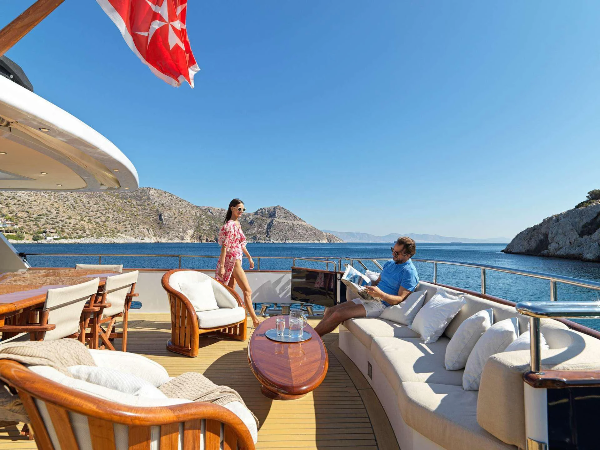 people sitting on lounge chairs on a boat aboard MIA ZOI Yacht for Charter
