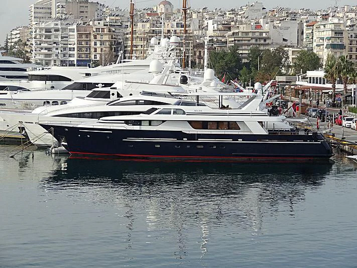 a large white boat in a harbor aboard MIA ZOI Yacht for Charter