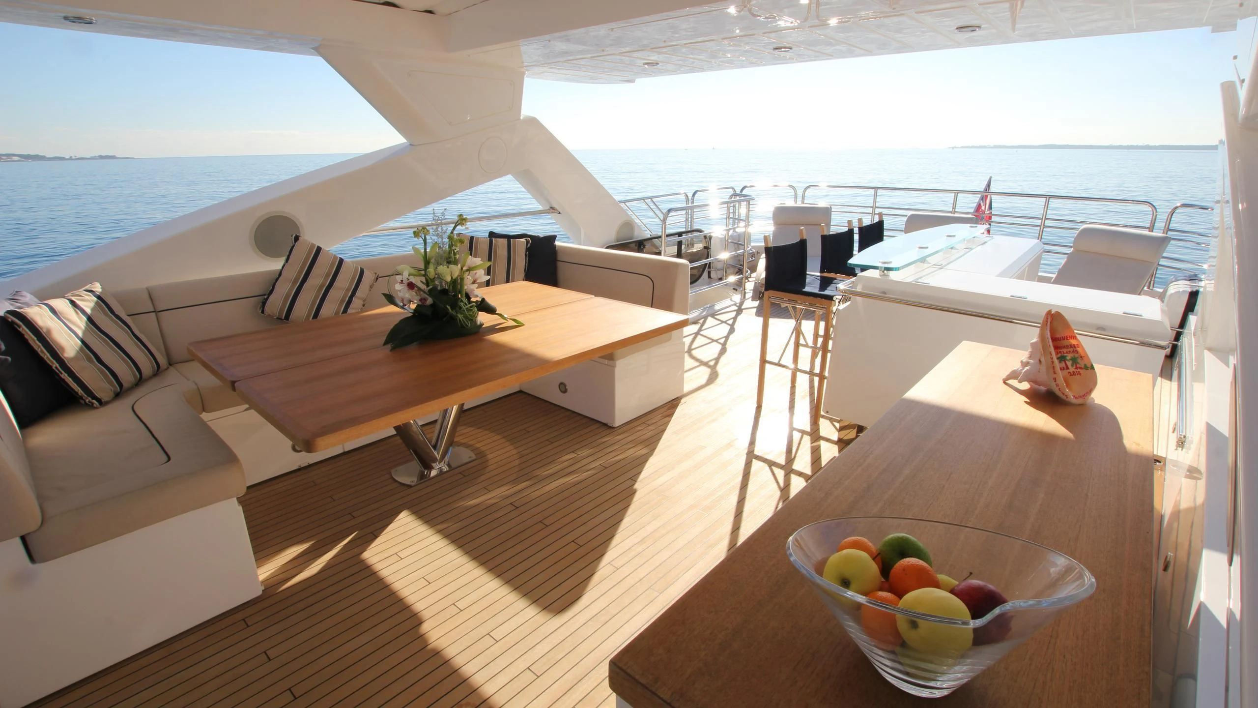 a table with a bowl of fruit on it aboard STELLA ANN Yacht for Sale