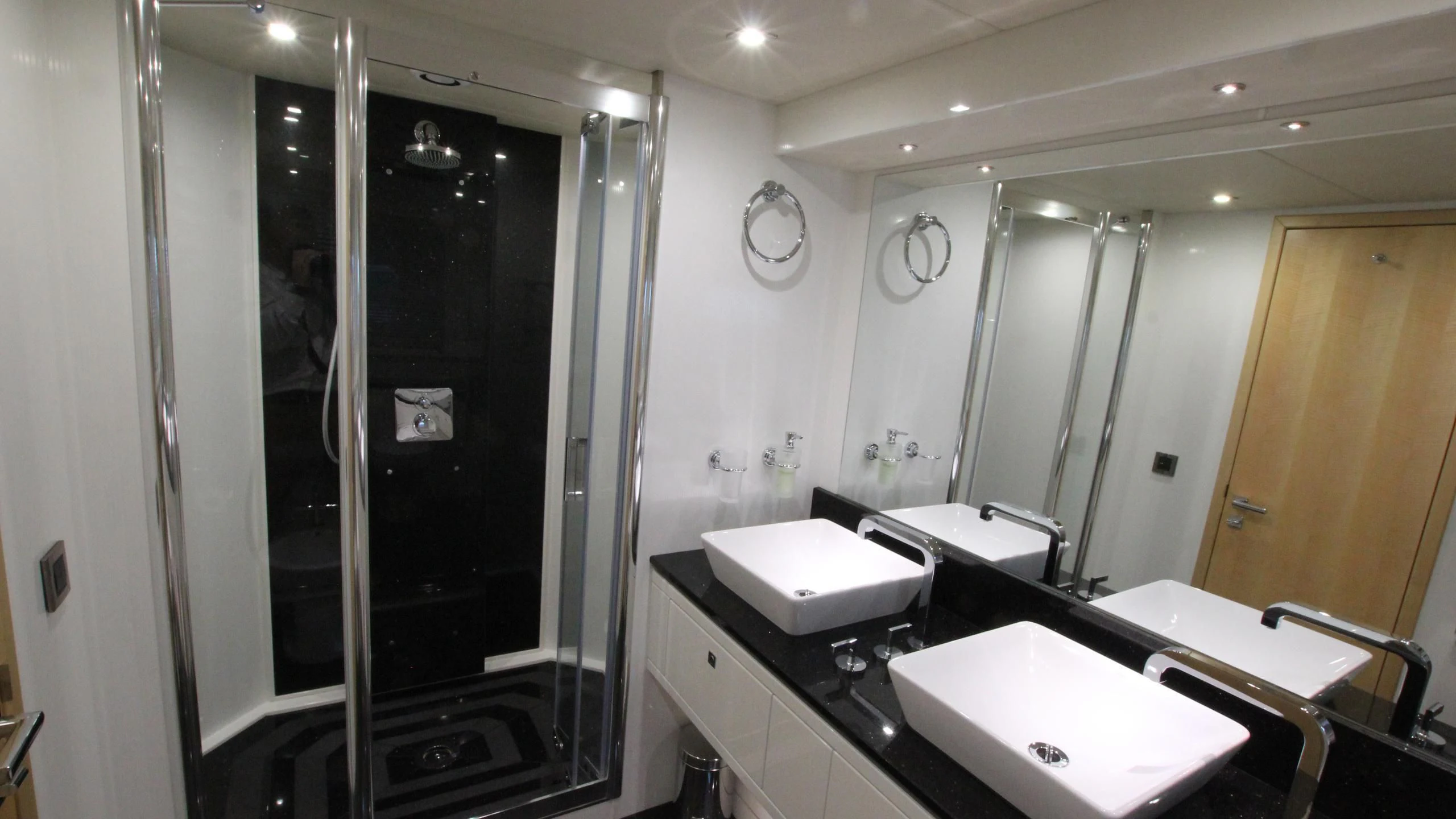a bathroom with sinks and a shower aboard STELLA ANN Yacht for Sale