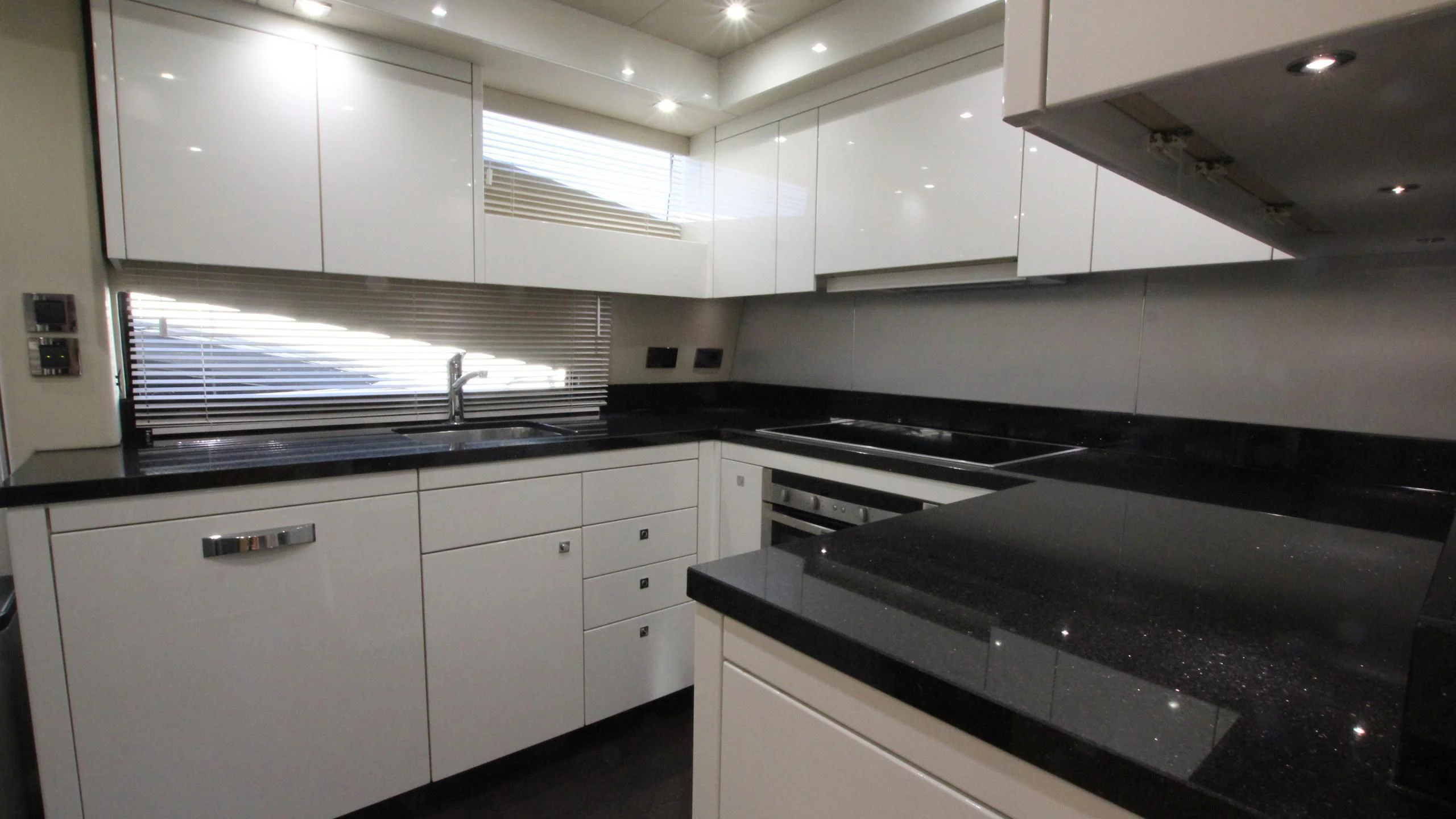 a kitchen with white cabinets aboard STELLA ANN Yacht for Sale