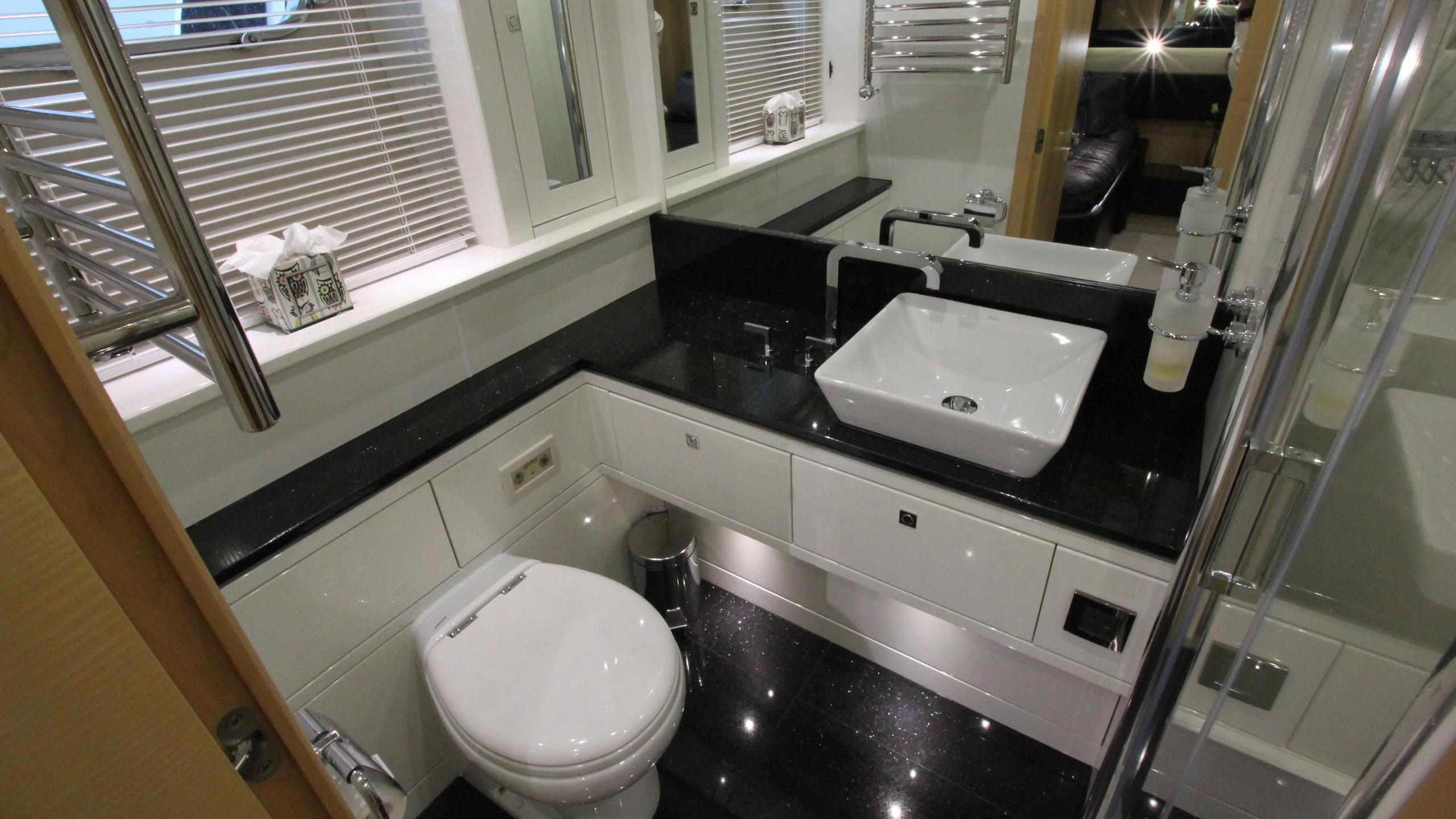 a bathroom with a sink and a toilet aboard STELLA ANN Yacht for Sale