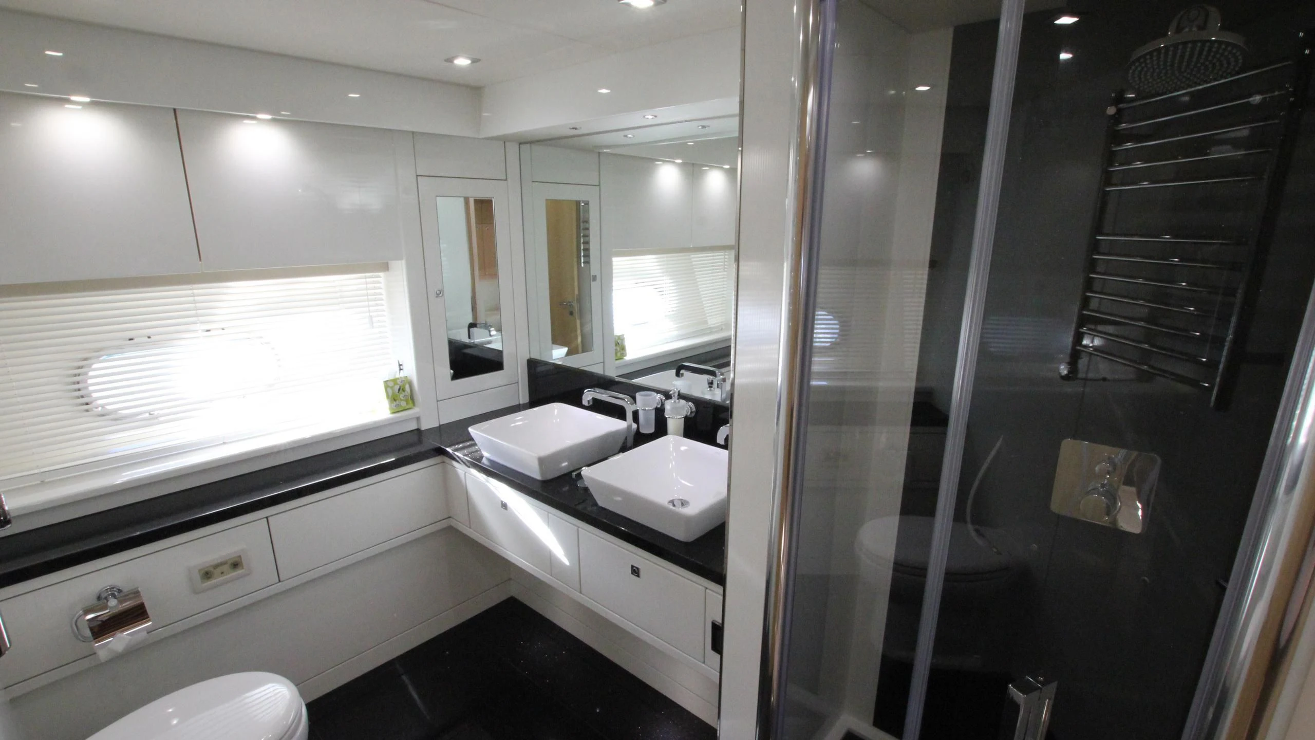 a bathroom with a glass shower aboard STELLA ANN Yacht for Sale