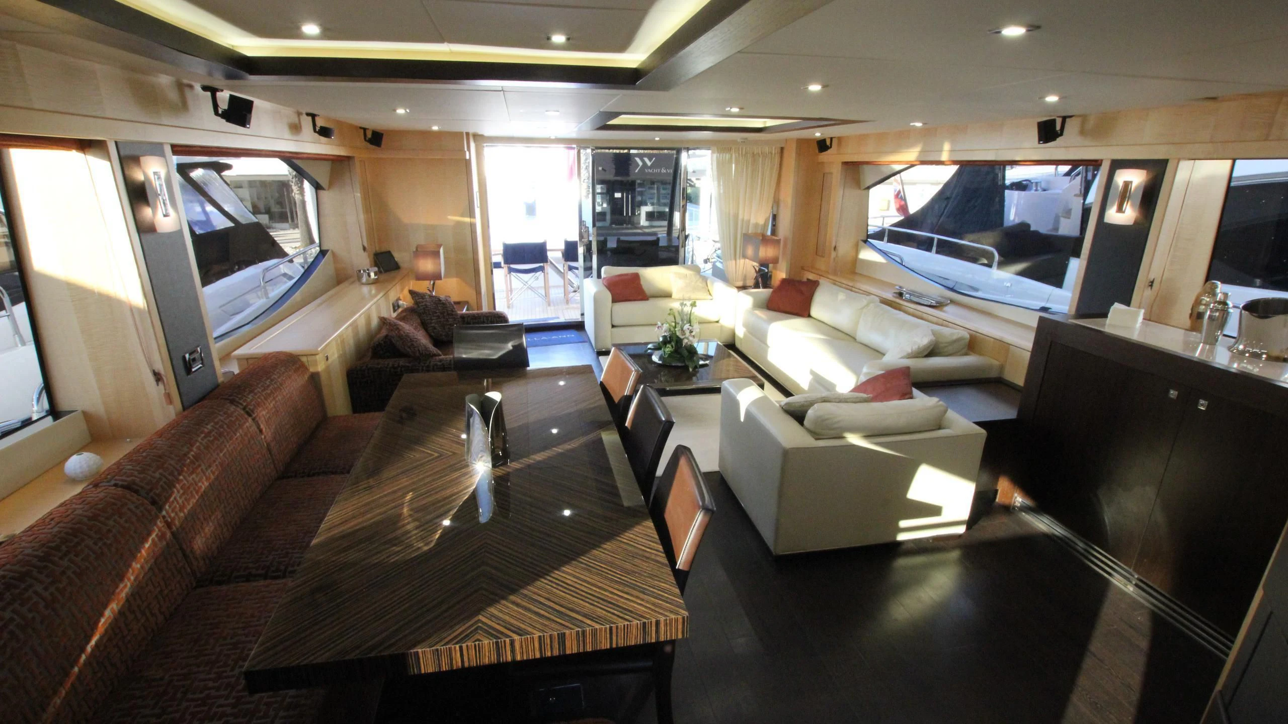 a living room with a large screen aboard STELLA ANN Yacht for Sale