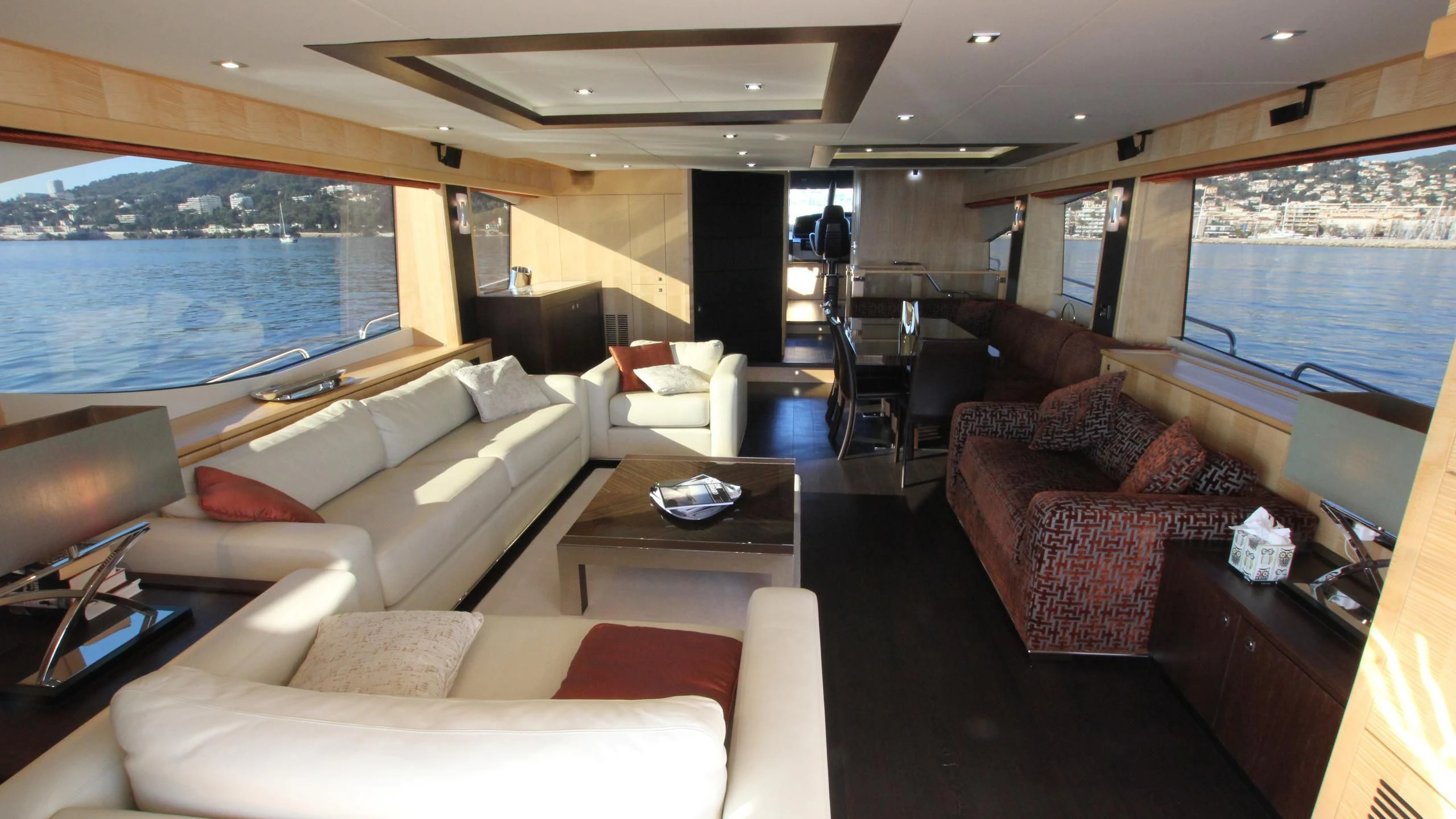 a living room with a large window aboard STELLA ANN Yacht for Sale