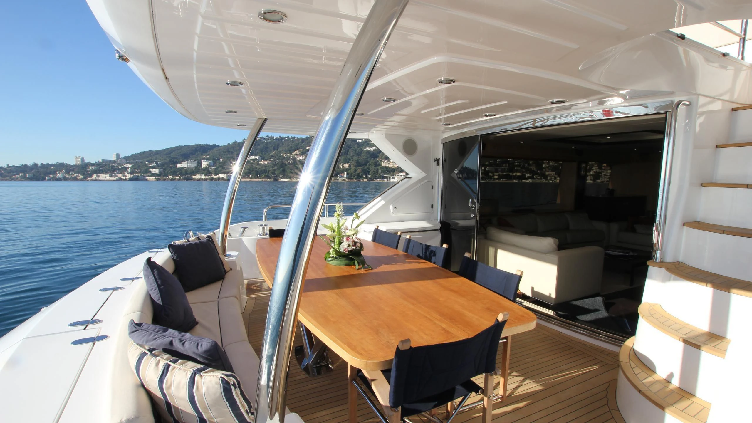 a boat with a table and chairs aboard STELLA ANN Yacht for Sale