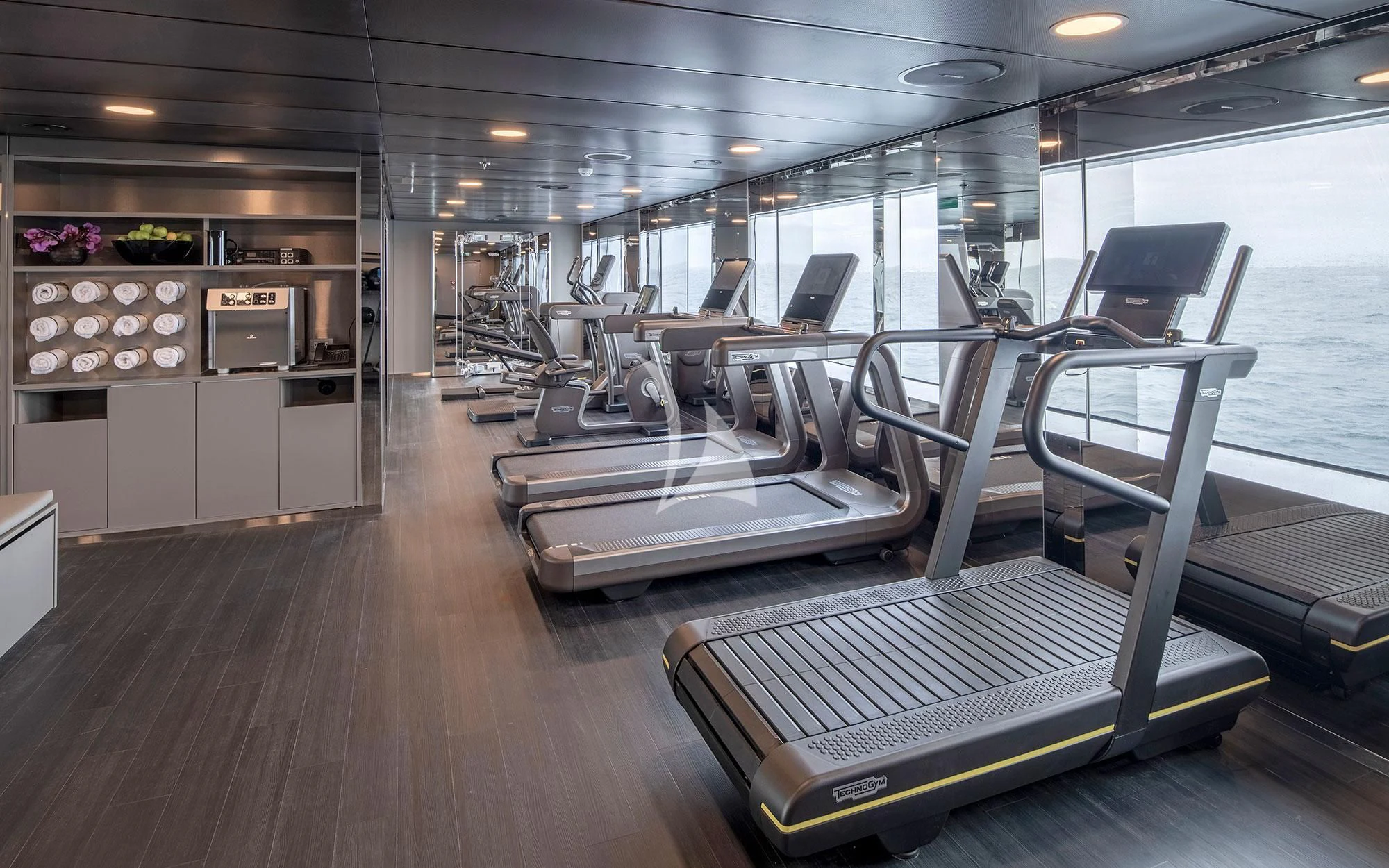 a large room with a large open door and a large open kitchen aboard SCENIC ECLIPSE Yacht for Sale