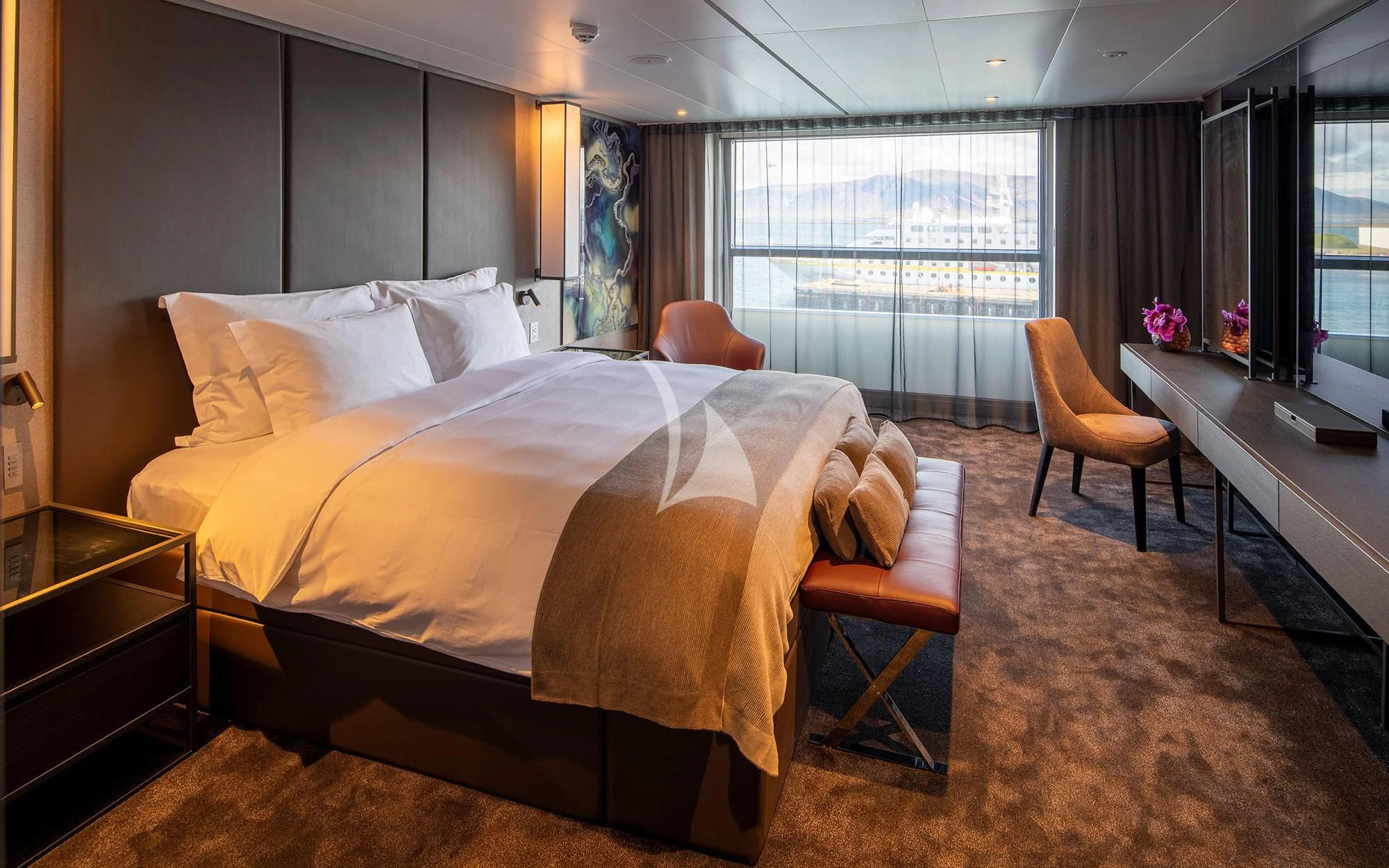 a bedroom with a bed and desk aboard SCENIC ECLIPSE Yacht for Sale
