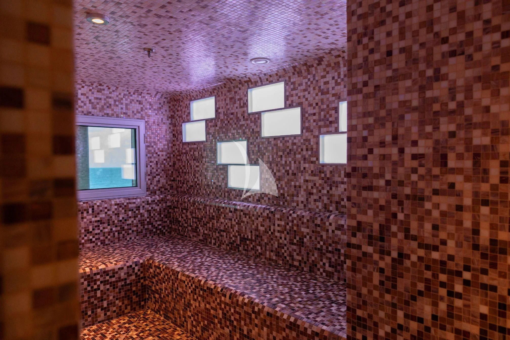 a room with a brick wall and a window aboard SCENIC ECLIPSE Yacht for Sale