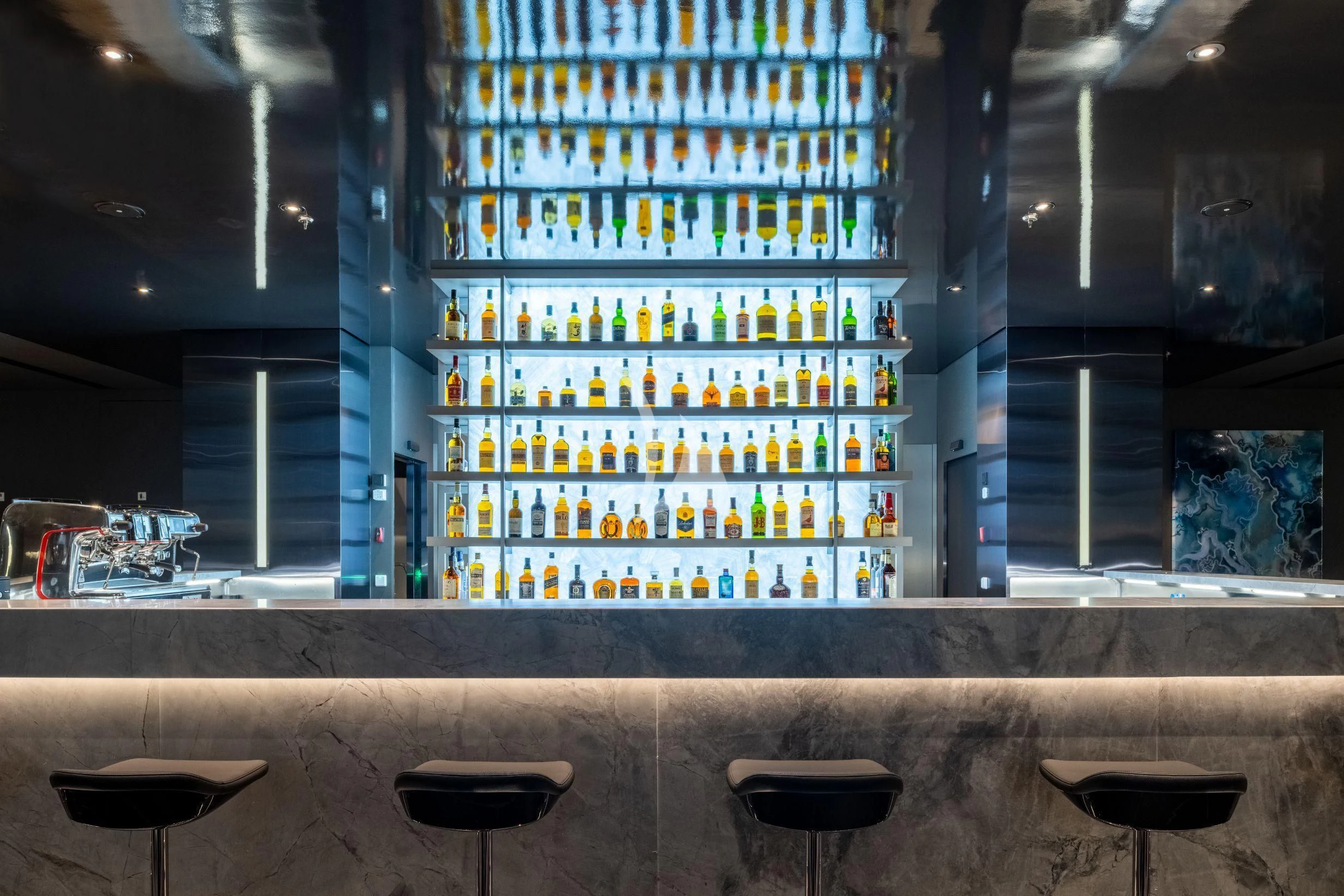a large display of colorful bottles aboard SCENIC ECLIPSE Yacht for Sale