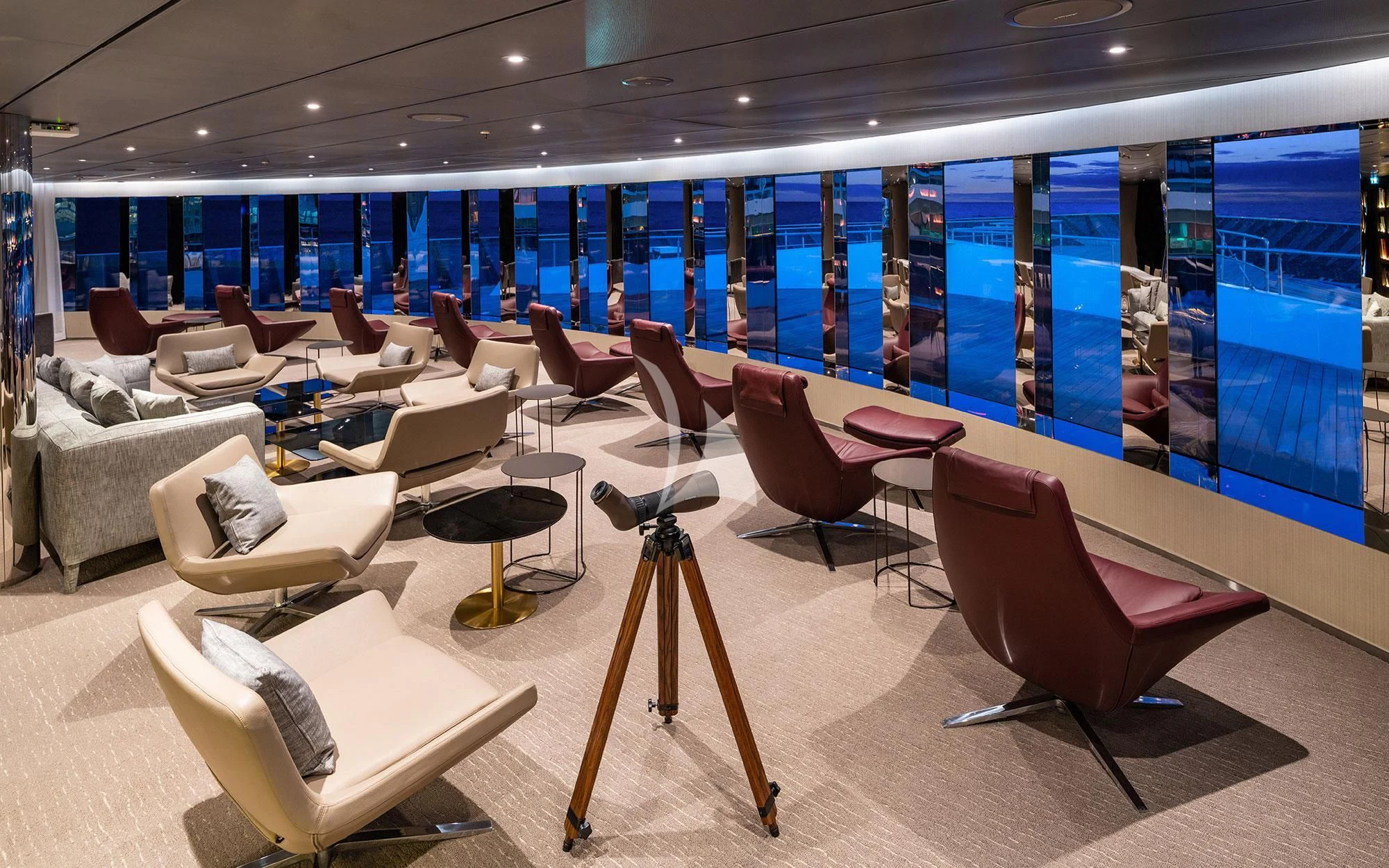 a room with chairs and tables aboard SCENIC ECLIPSE Yacht for Sale