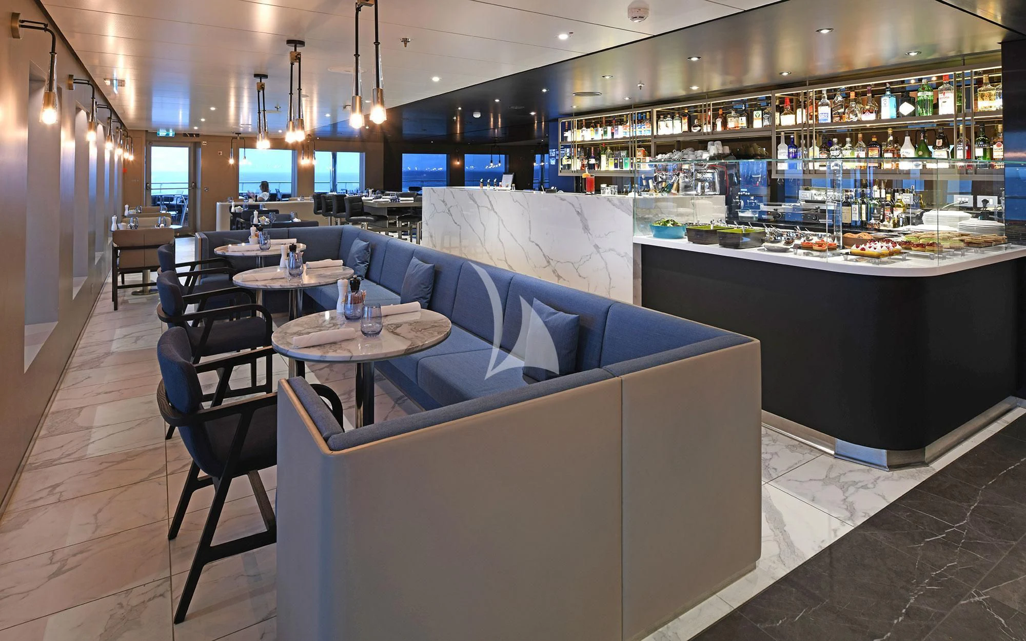 a room with a couch and a table with food on it aboard SCENIC ECLIPSE Yacht for Sale