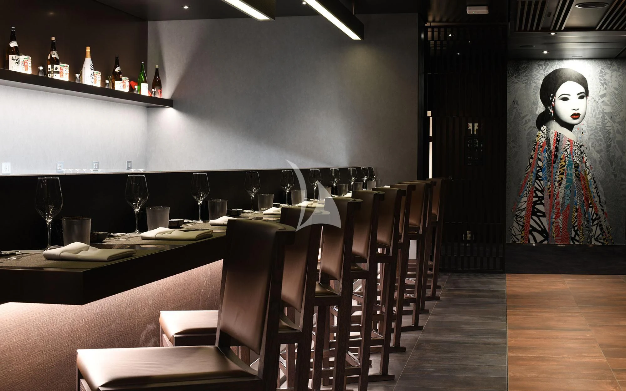 a bar with a painting on the wall aboard SCENIC ECLIPSE Yacht for Sale