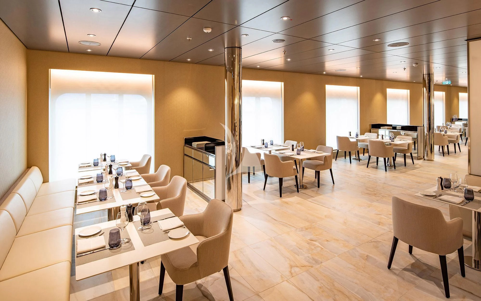 a room with tables and chairs aboard SCENIC ECLIPSE Yacht for Sale
