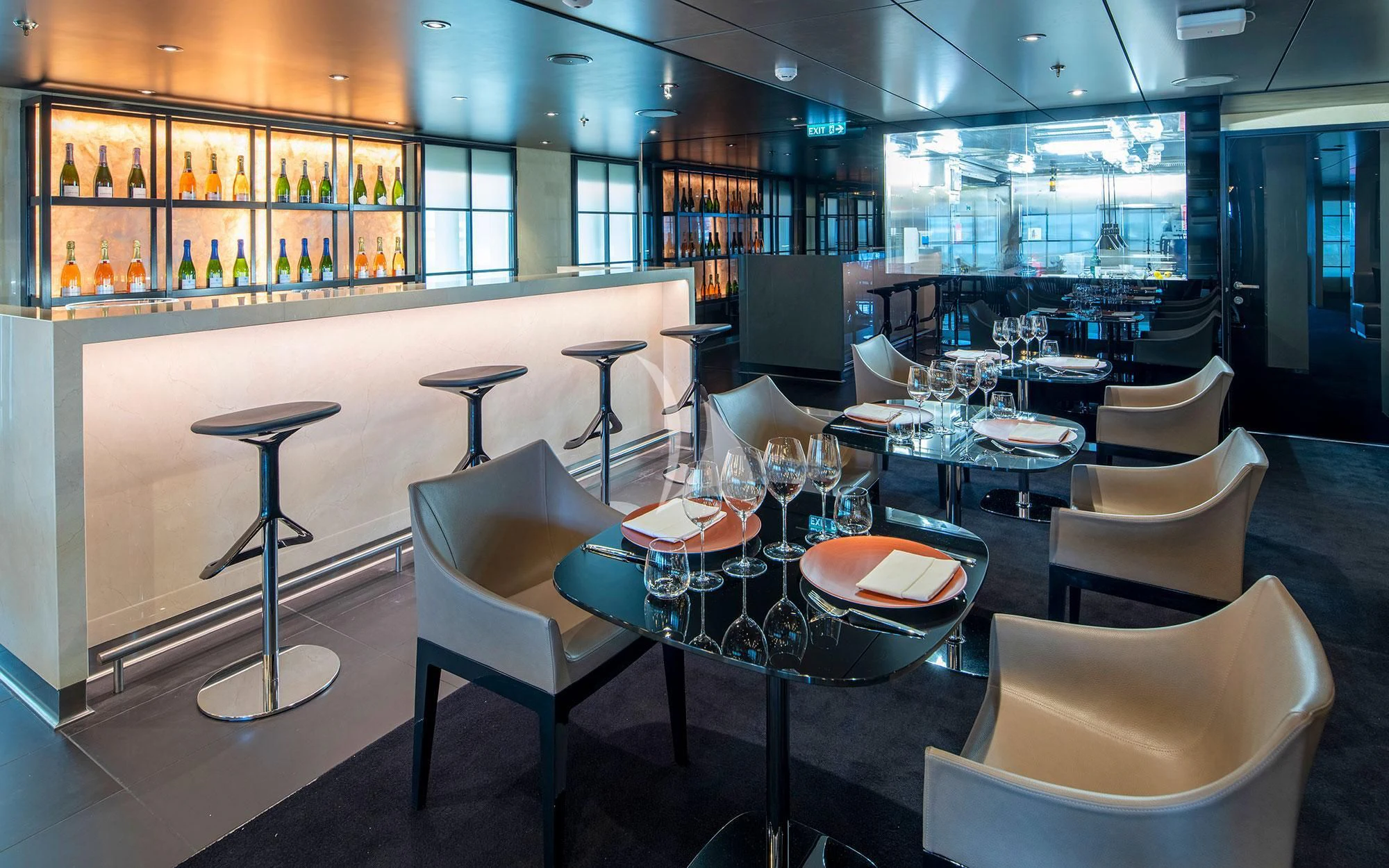 a room with a table and chairs aboard SCENIC ECLIPSE Yacht for Sale