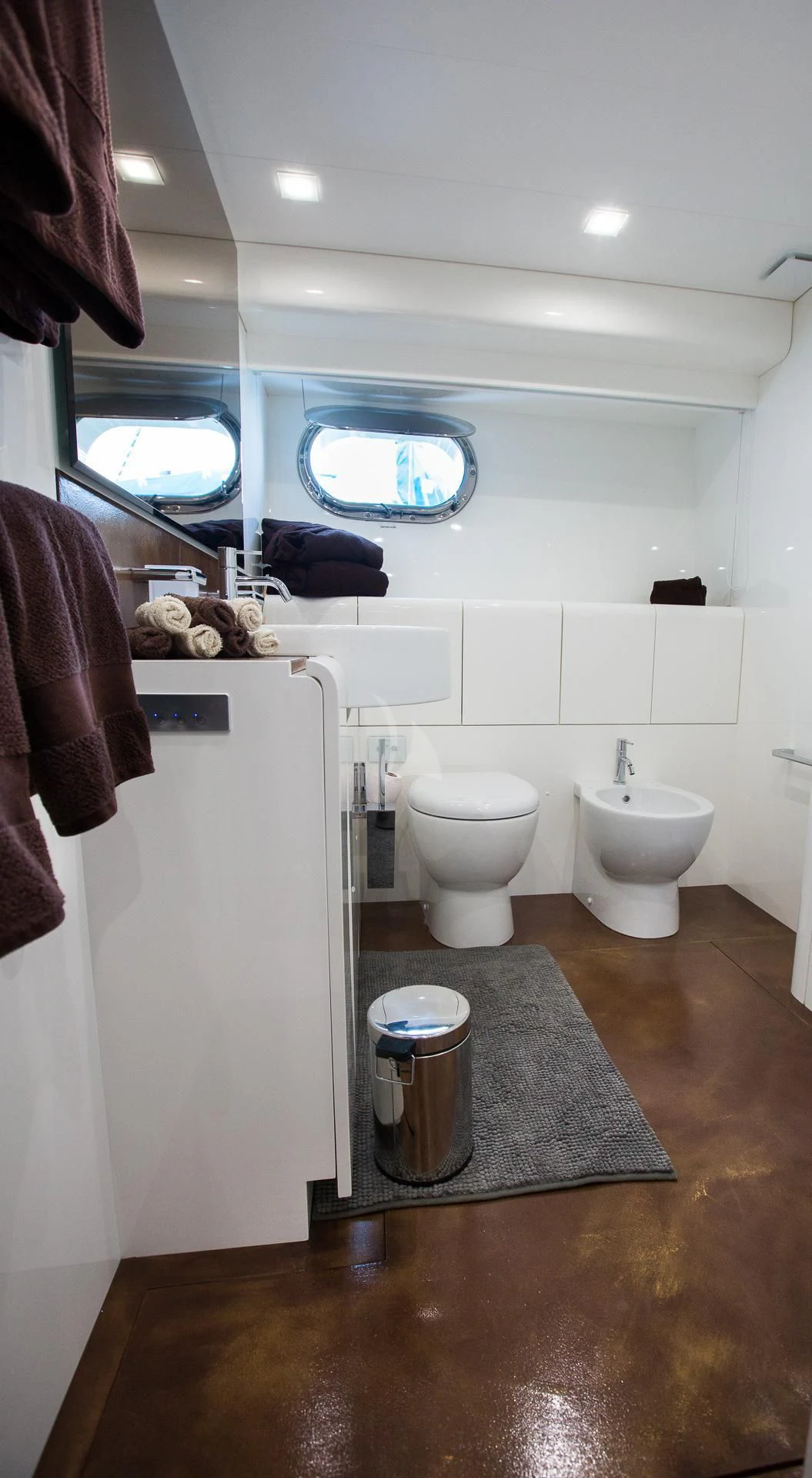 a bathroom with a large mirror aboard CAMILLA A Yacht for Sale