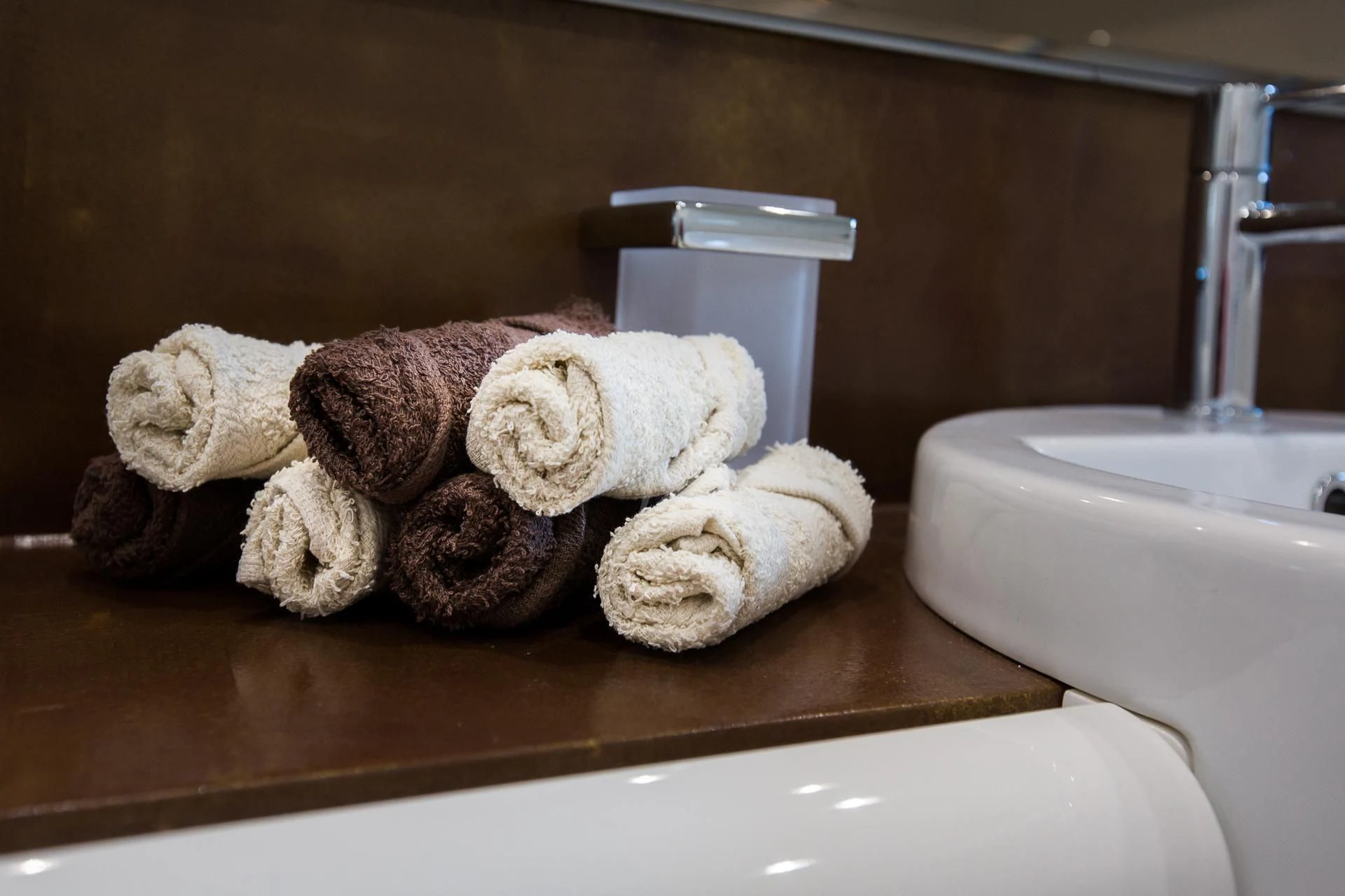 a group of teddy bears on a counter next to a toilet aboard CAMILLA A Yacht for Sale