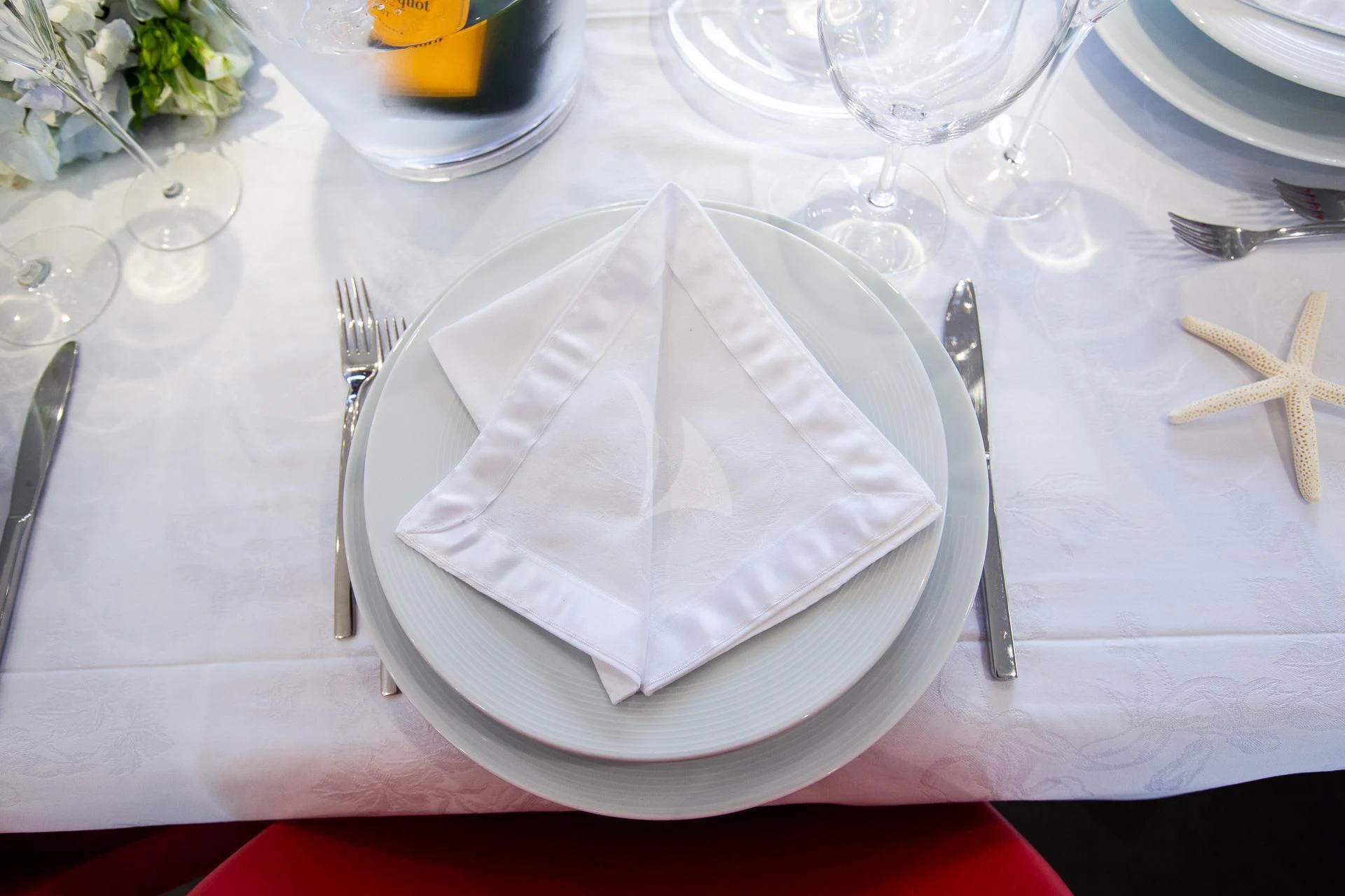 a napkin on a plate aboard CAMILLA A Yacht for Sale