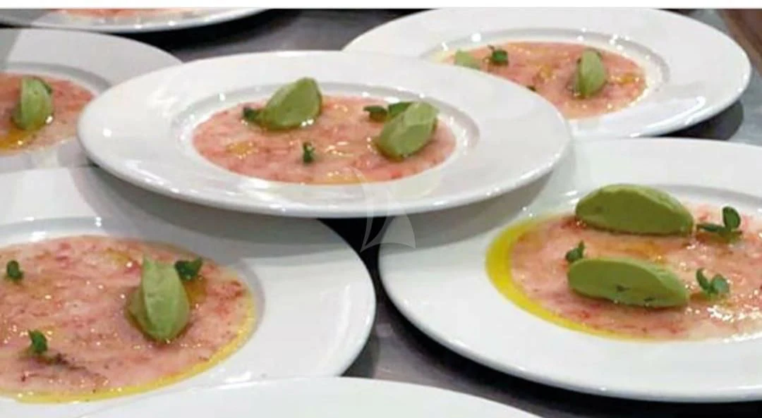 a group of plates with food on them aboard CAMILLA A Yacht for Sale