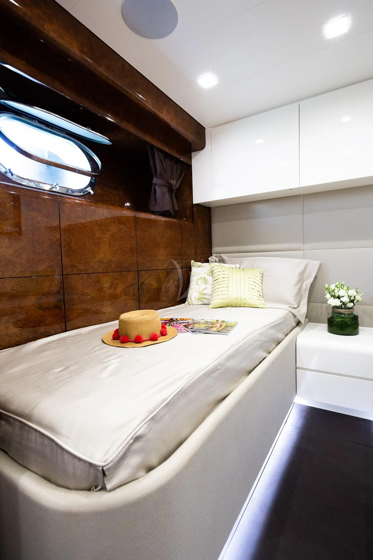 a bed with a white bed spread aboard CAMILLA A Yacht for Sale