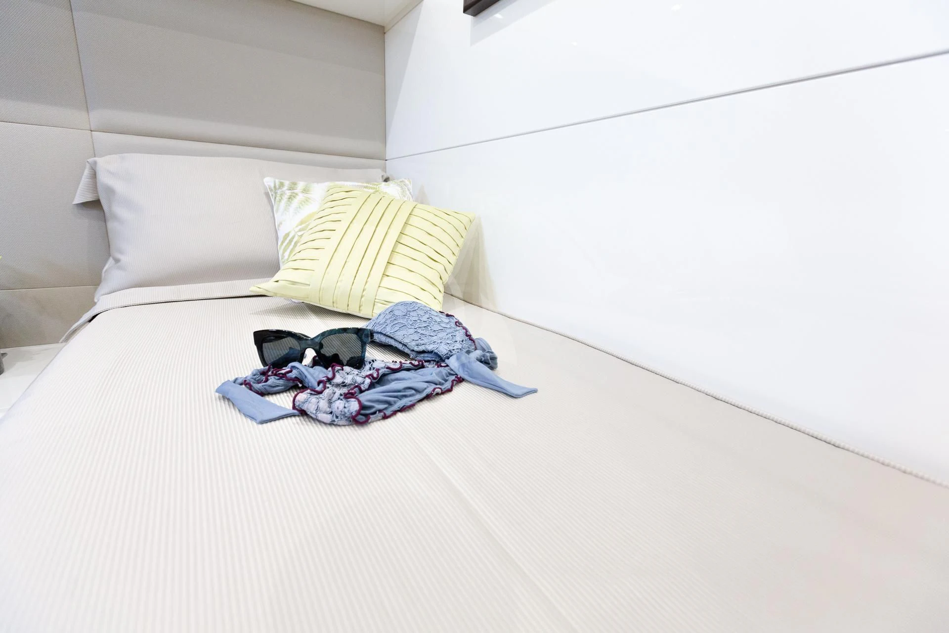 a pair of underwear on a bed aboard CAMILLA A Yacht for Sale