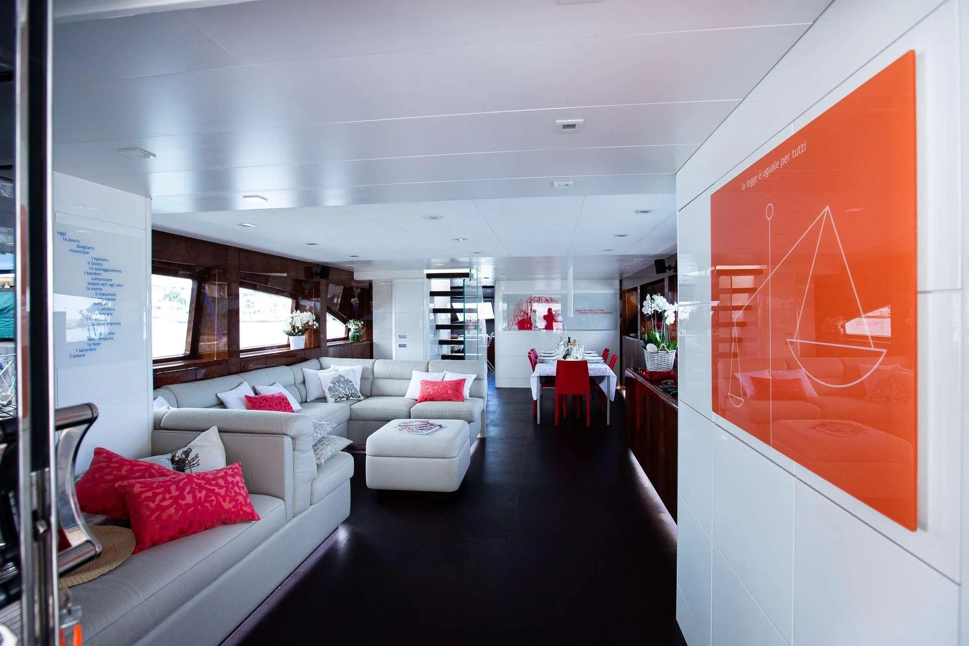 a room with a couch and a table and chairs aboard CAMILLA A Yacht for Sale
