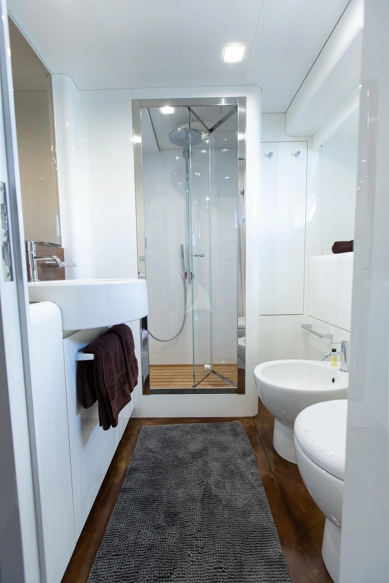 a bathroom with a glass shower aboard CAMILLA A Yacht for Sale