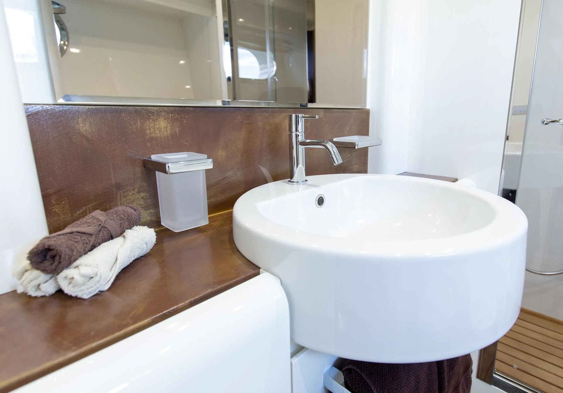 a cat lying on a sink aboard CAMILLA A Yacht for Sale