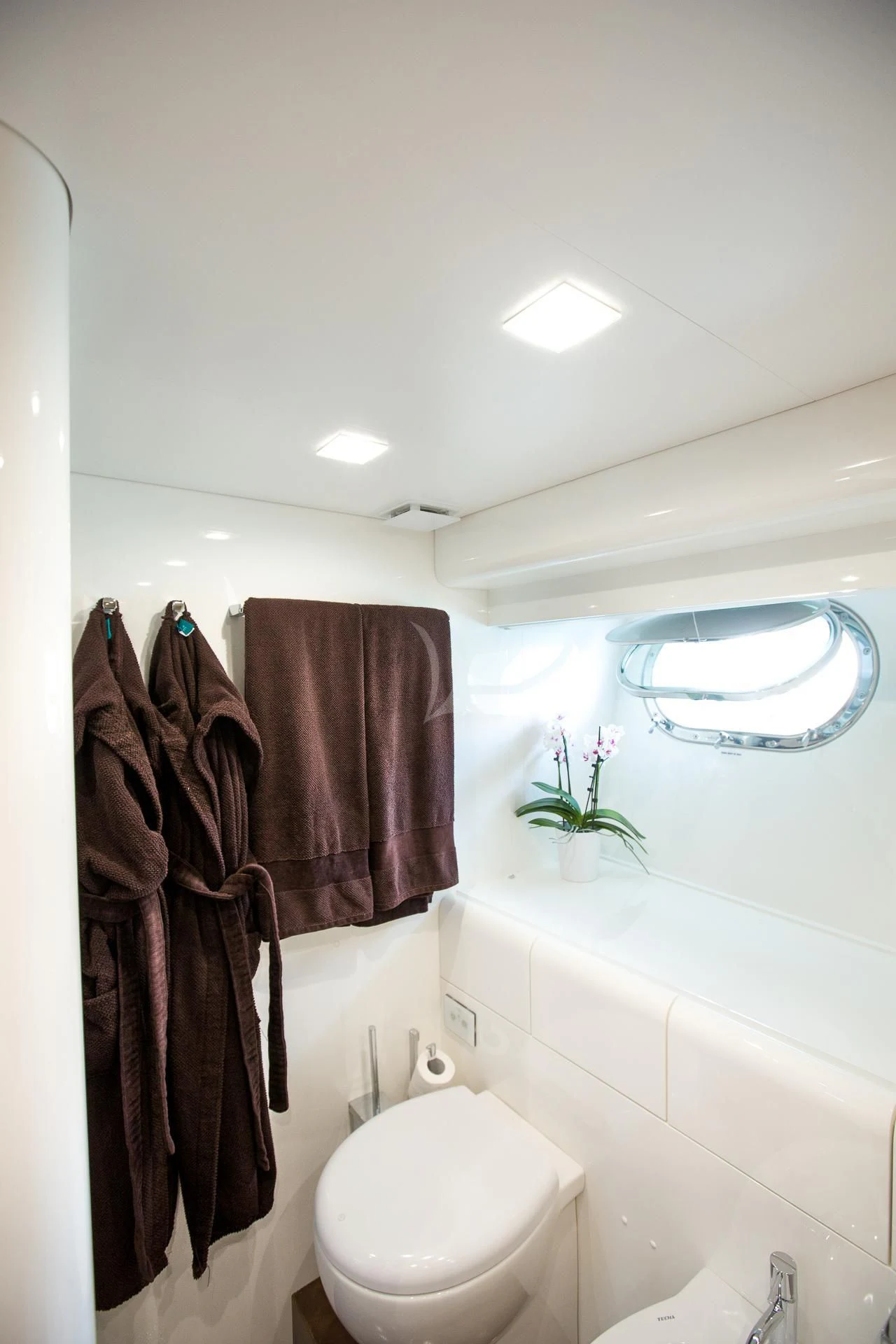 a bathroom with a towel on the wall aboard CAMILLA A Yacht for Sale