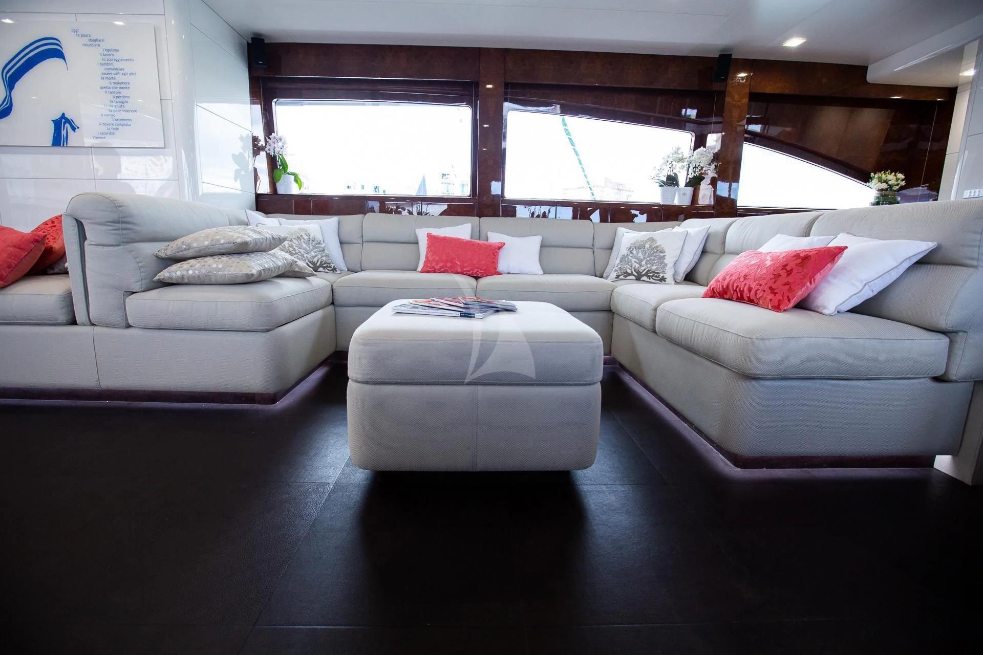 a living room with a couch and a table aboard CAMILLA A Yacht for Sale