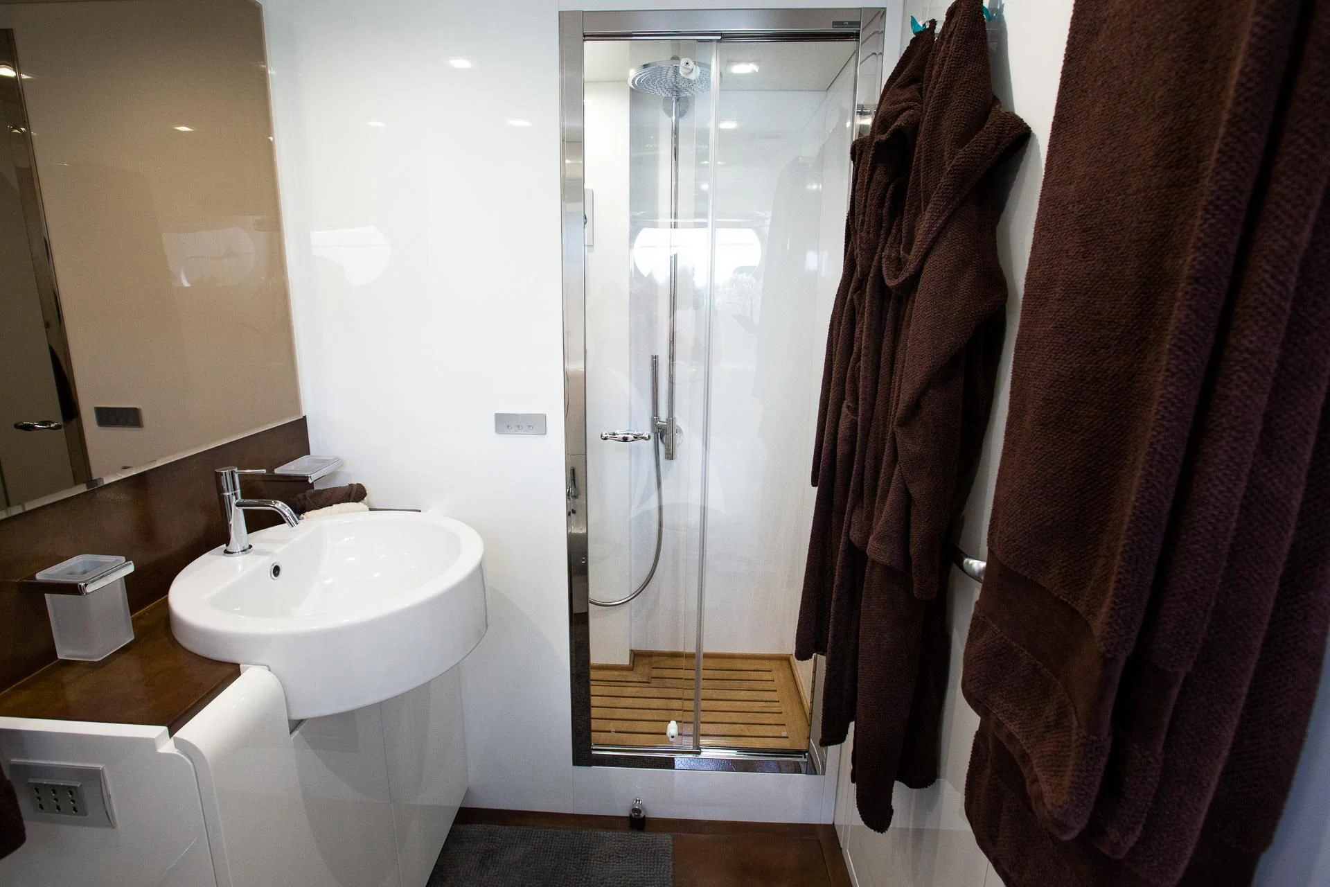 a bathroom with a shower and sink aboard CAMILLA A Yacht for Sale