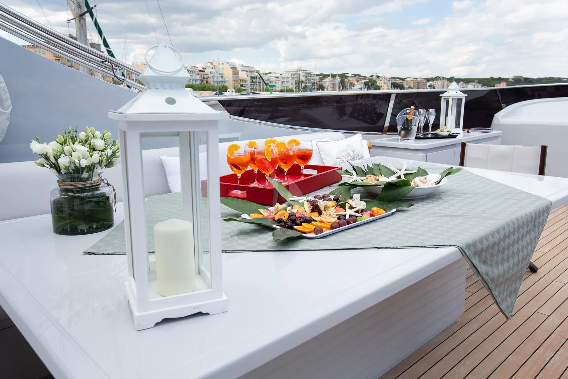 a table with flowers and a vase of flowers on it aboard CAMILLA A Yacht for Sale