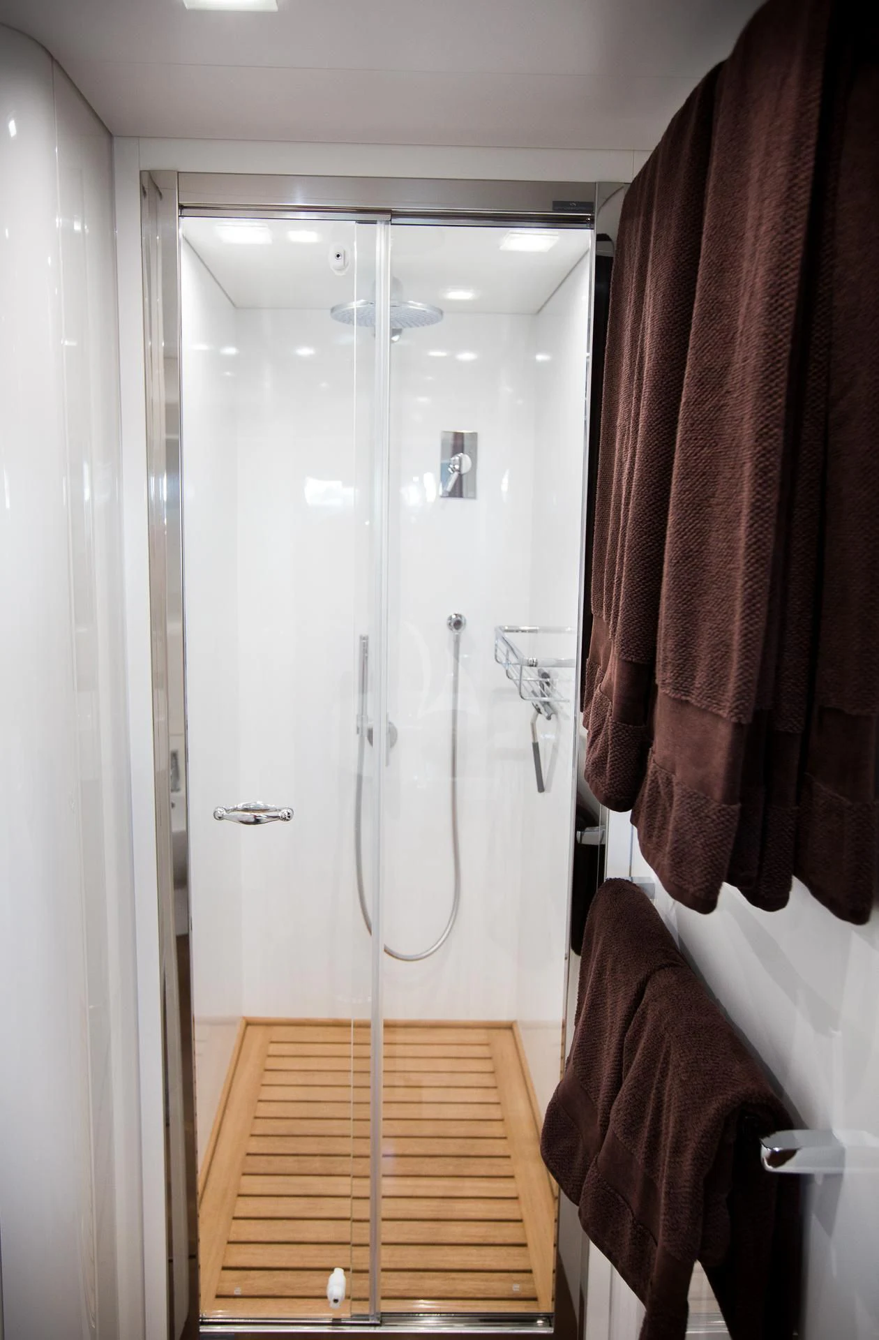 a shower with a towel on the wall aboard CAMILLA A Yacht for Sale