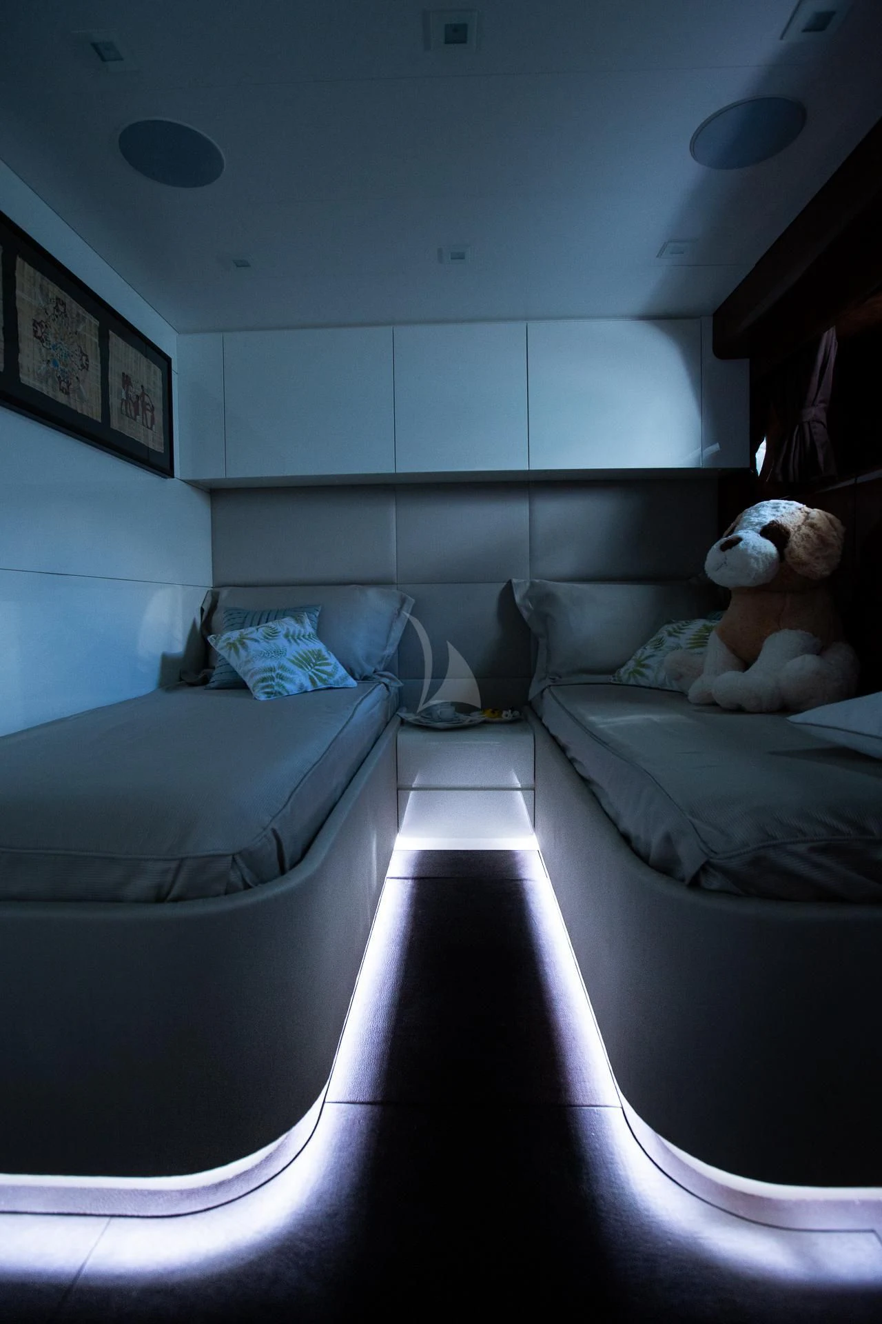 a bedroom with a bed and a stuffed animal aboard CAMILLA A Yacht for Sale