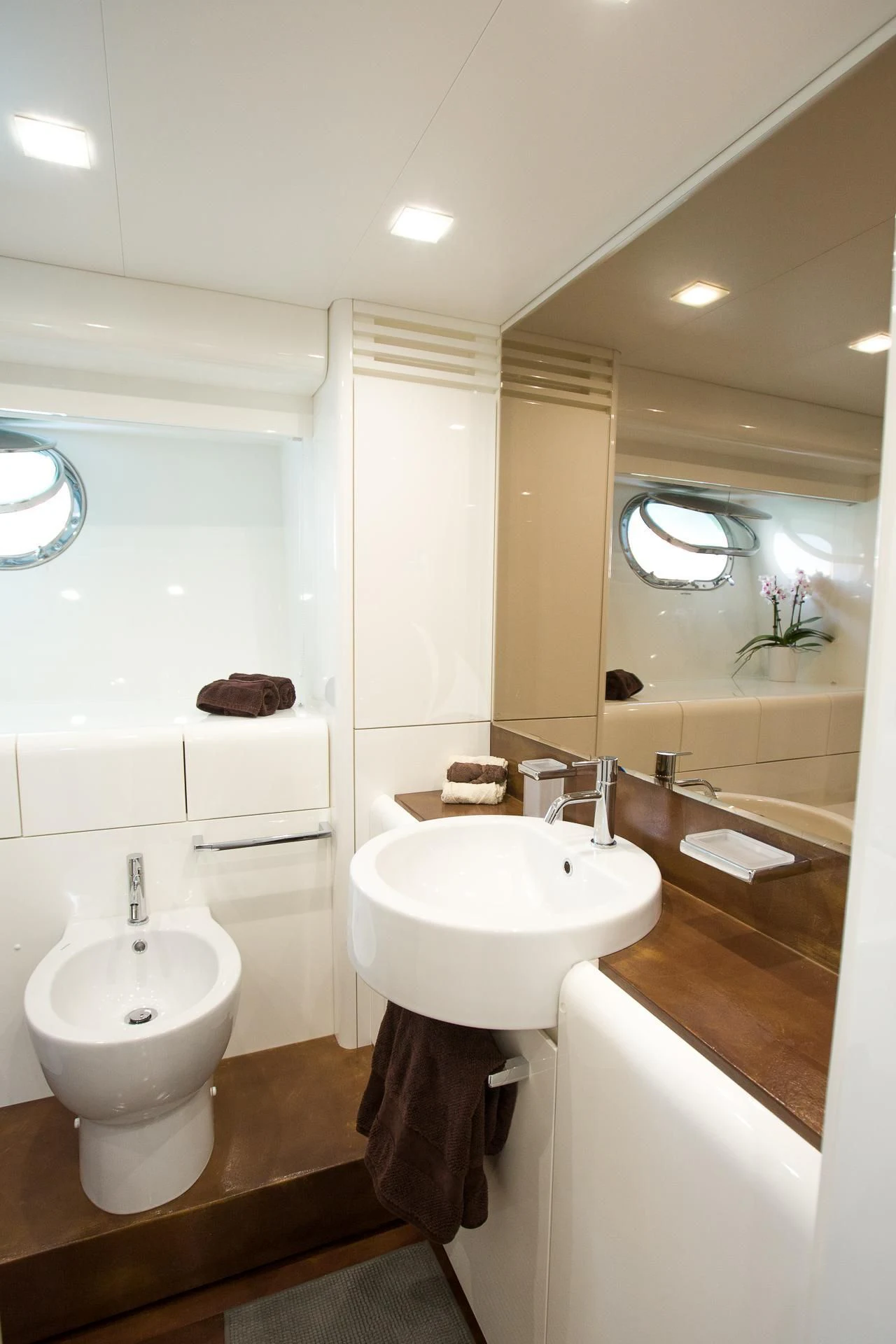 a bathroom with a large mirror aboard CAMILLA A Yacht for Sale
