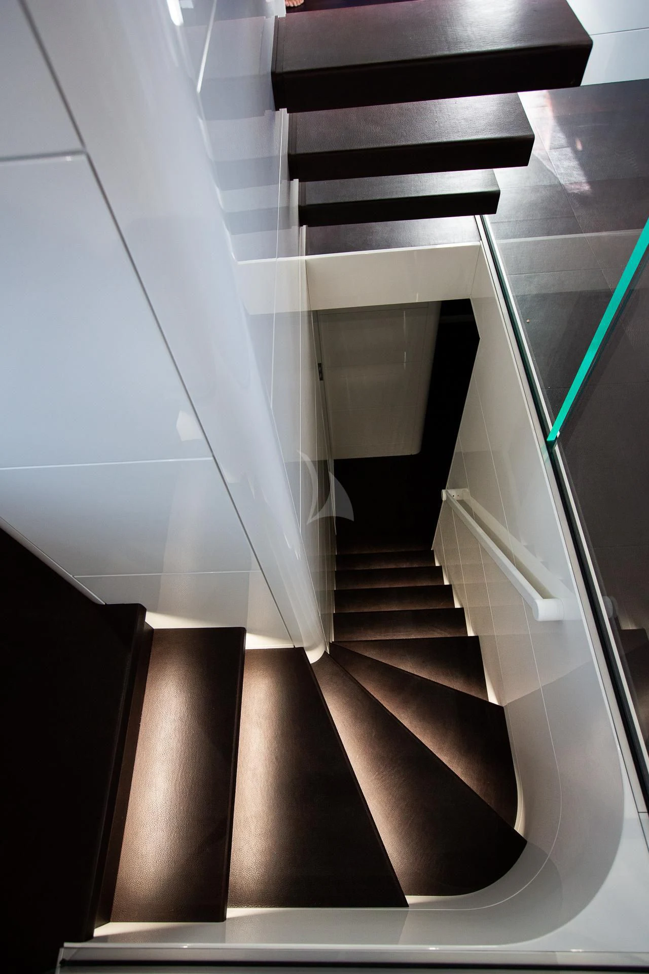 a staircase with a glass railing aboard CAMILLA A Yacht for Sale