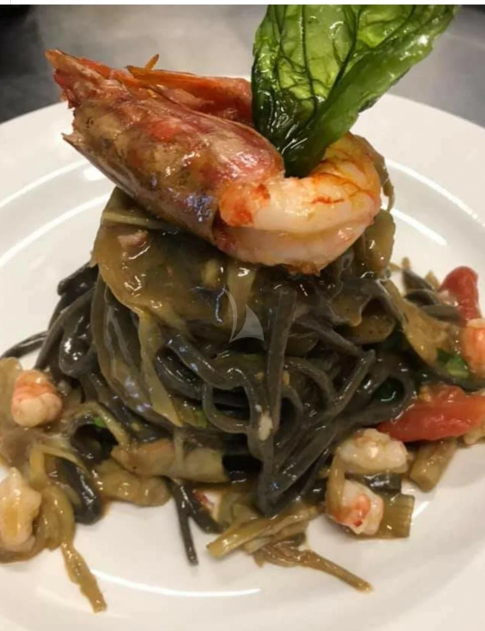a plate of food aboard CAMILLA A Yacht for Sale