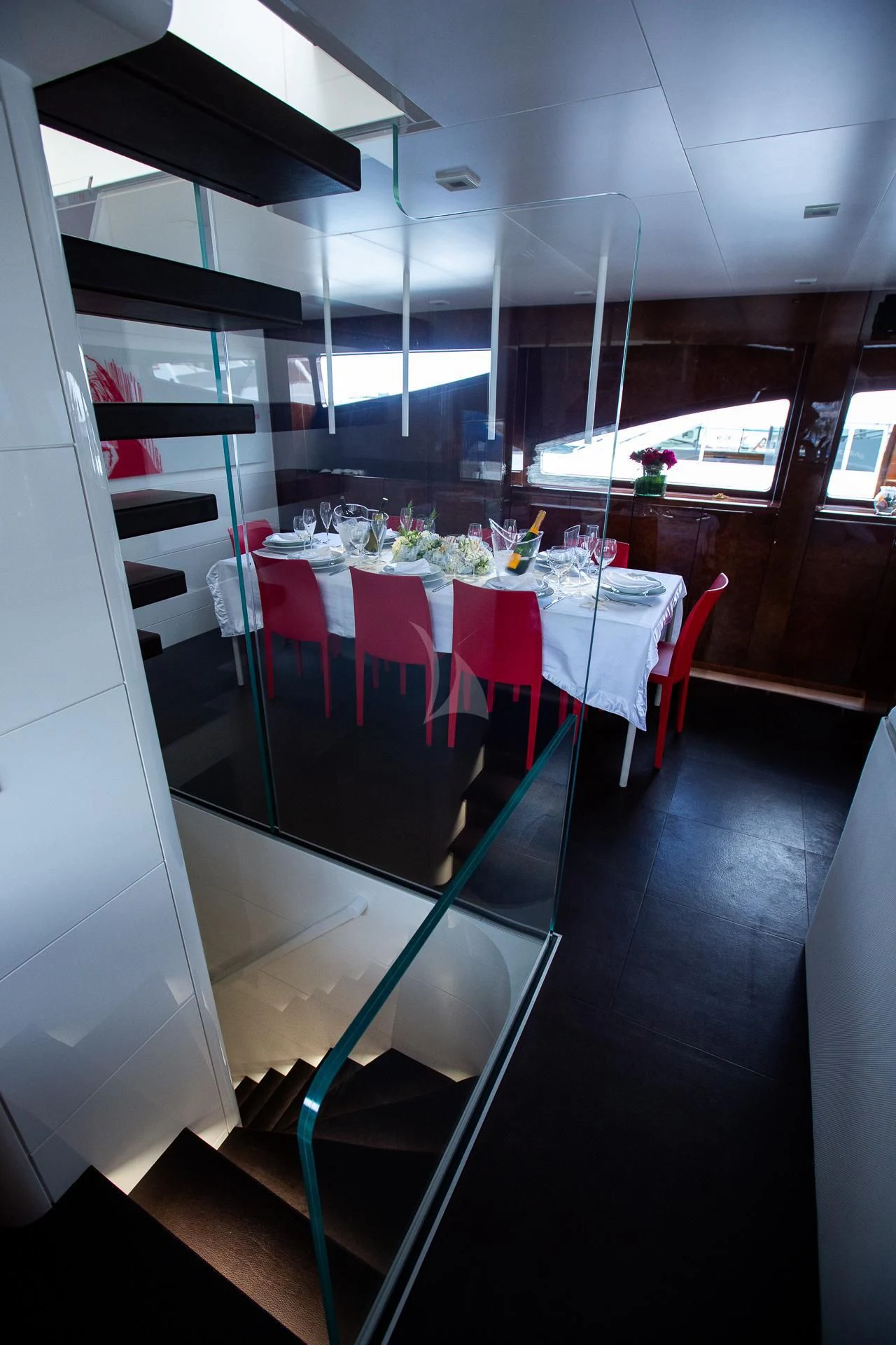 a dining room with a table and chairs aboard CAMILLA A Yacht for Sale