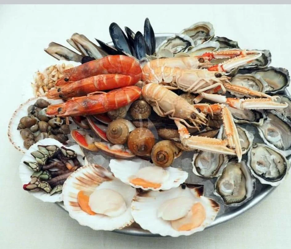 a plate of seafood aboard CAMILLA A Yacht for Sale