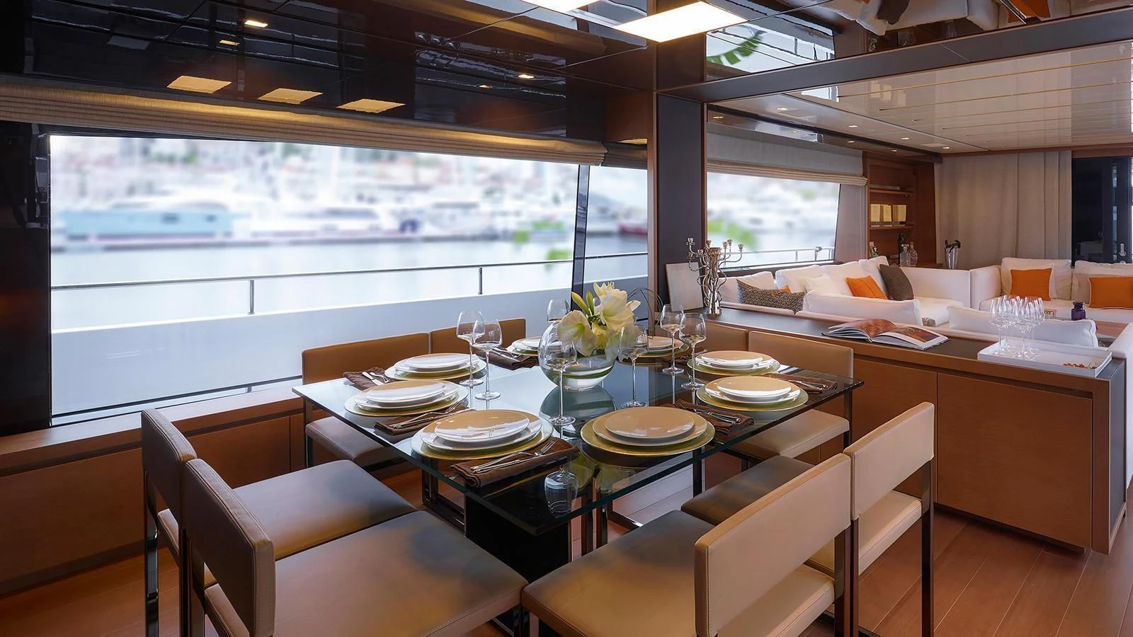 a dining room with a large window aboard ROYAL Yacht for Sale