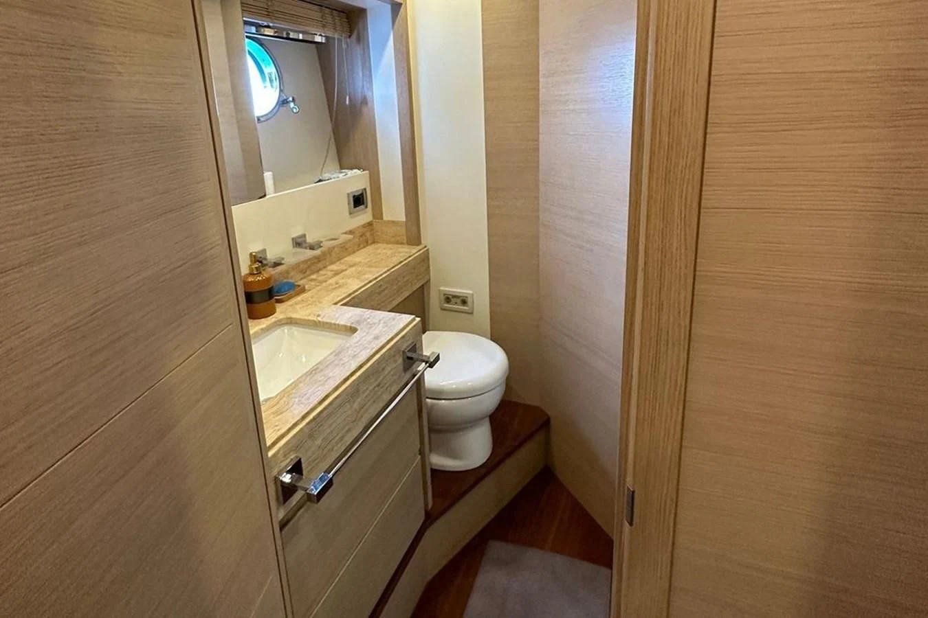a bathroom with a toilet and sink aboard AZIMUT 84/12 Yacht for Sale