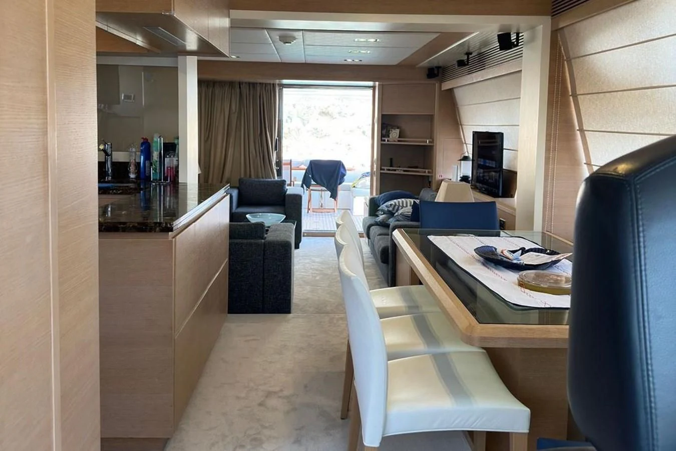 a room with a couch and a table aboard AZIMUT 84/12 Yacht for Sale