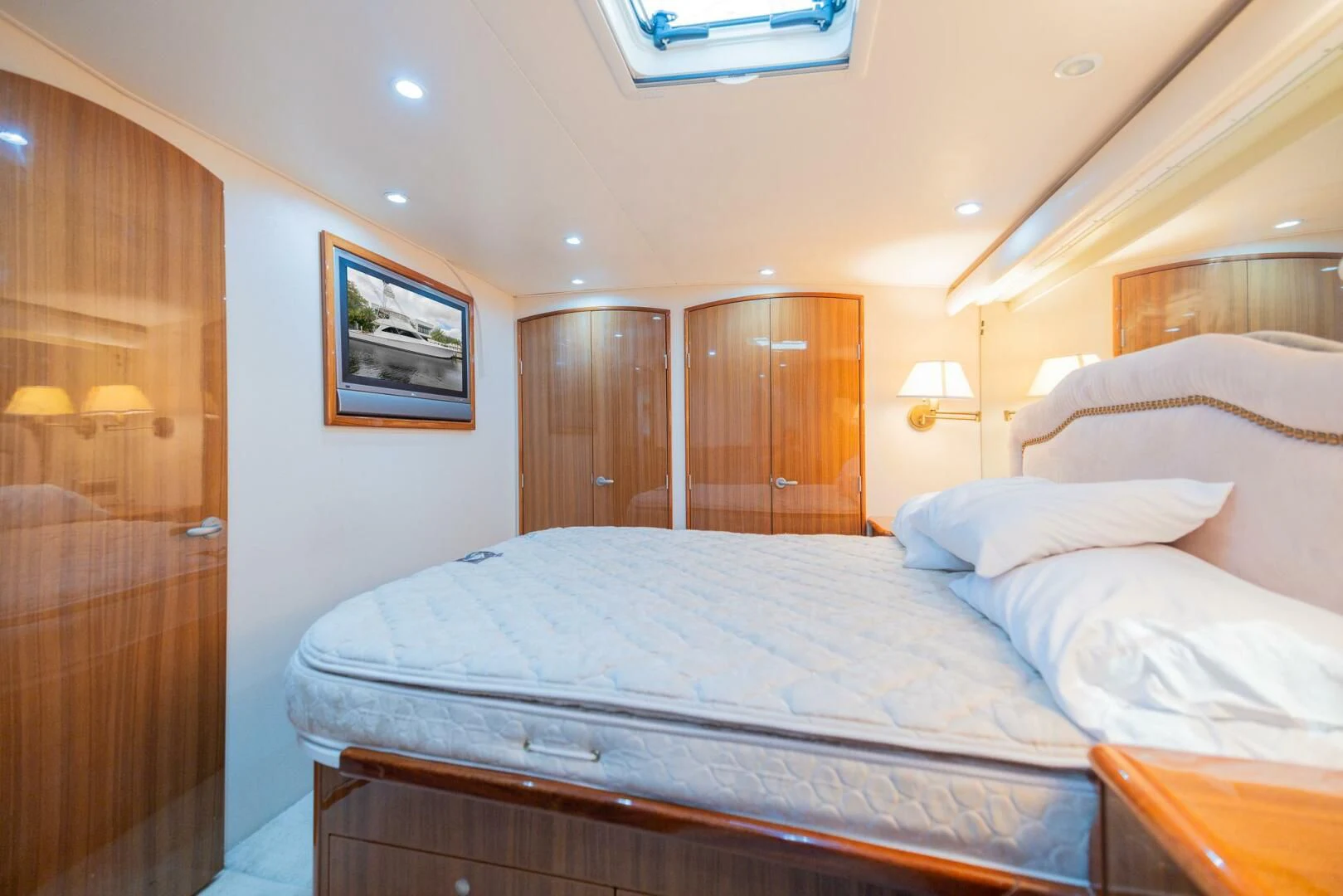 a bed with white sheets aboard STABILIZED Yacht for Sale