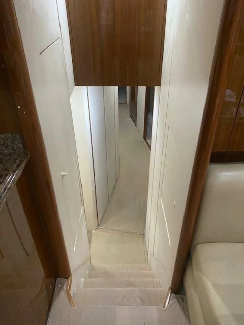 a door with a wood handle aboard STABILIZED Yacht for Sale