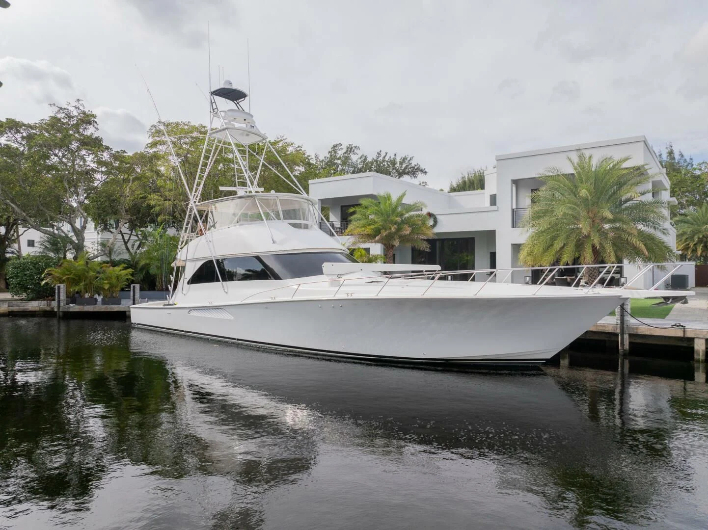 a white boat in a body of water aboard STABILIZED Yacht for Sale
