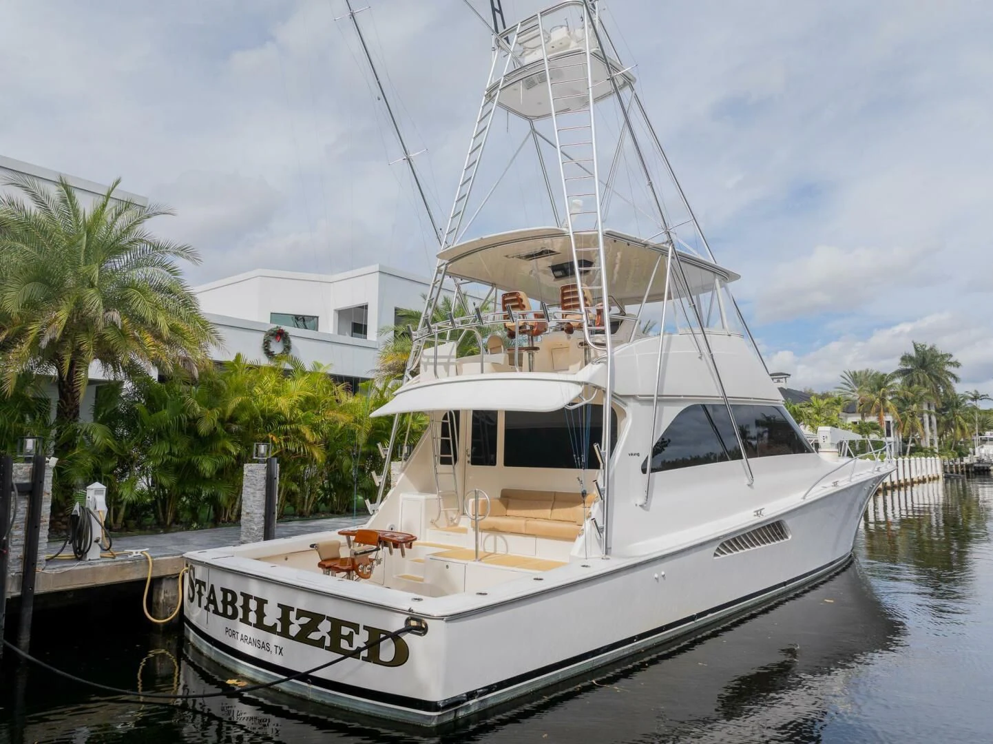 a white boat docked aboard STABILIZED Yacht for Sale